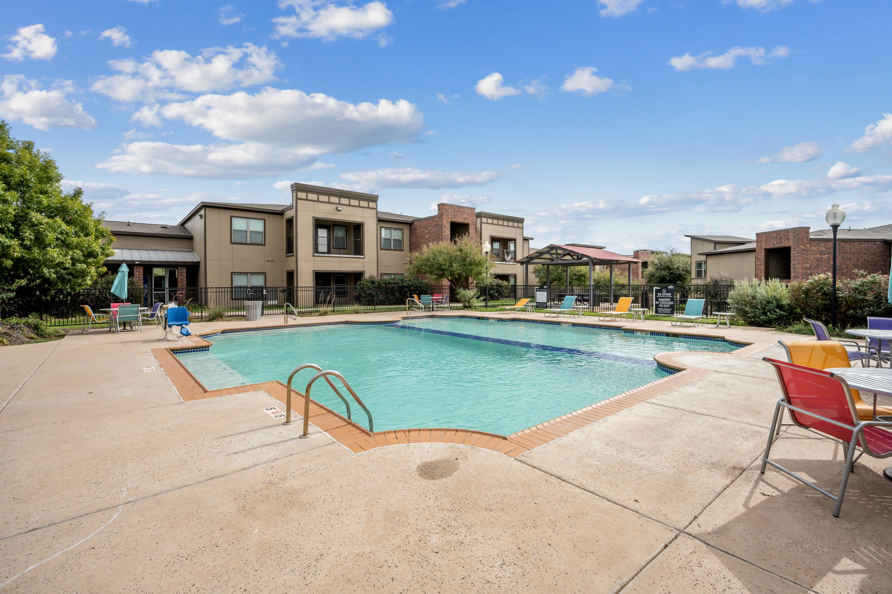 View of the spacious pool and lounge seating at The BLVD in San Angelo, Texas