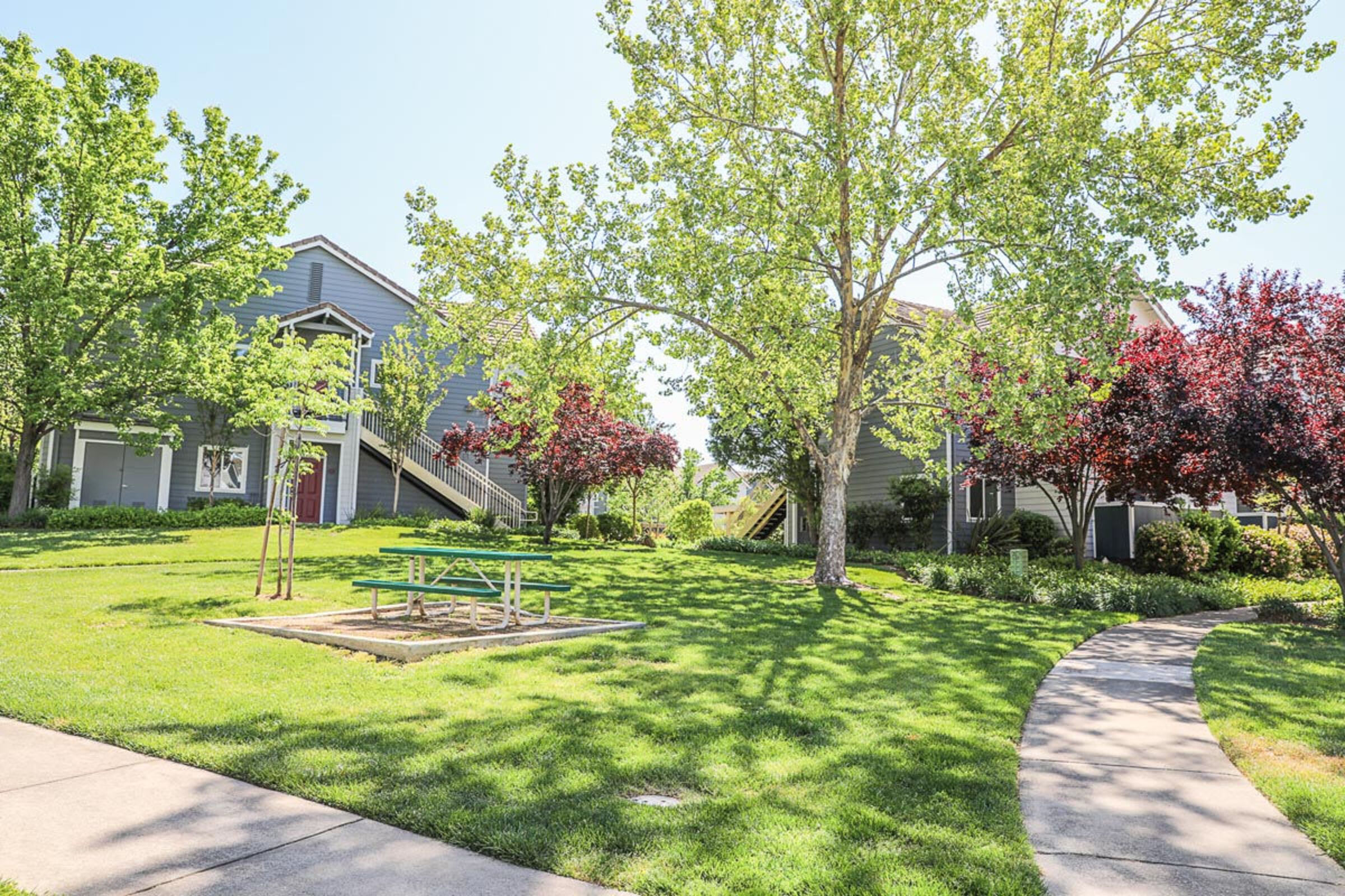 Pathway through the landscaped grounds at Rocklin Ranch Apartments in Rocklin, California