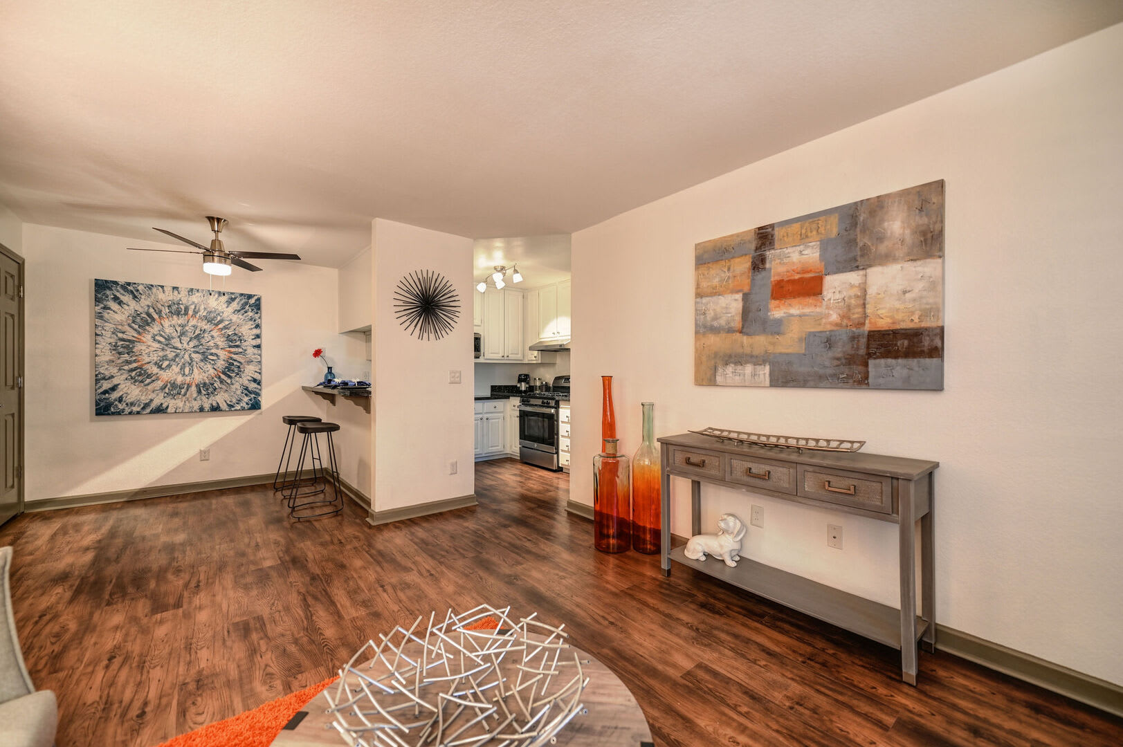 Open floor plan with wood style flooring at Lake Pointe Apartments in Folsom, California