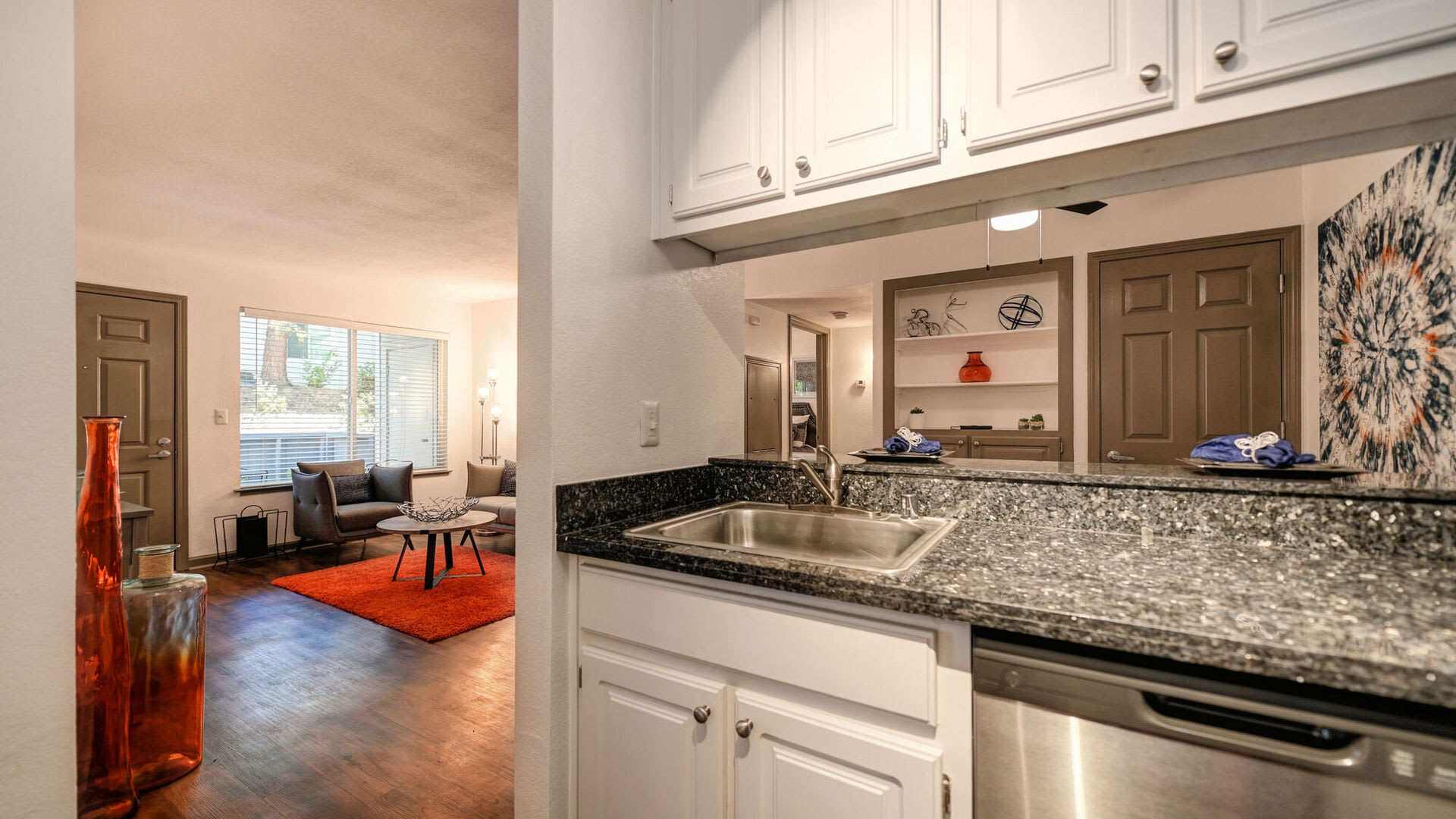 Kitchen and living room at Lake Pointe Apartments in Folsom, California