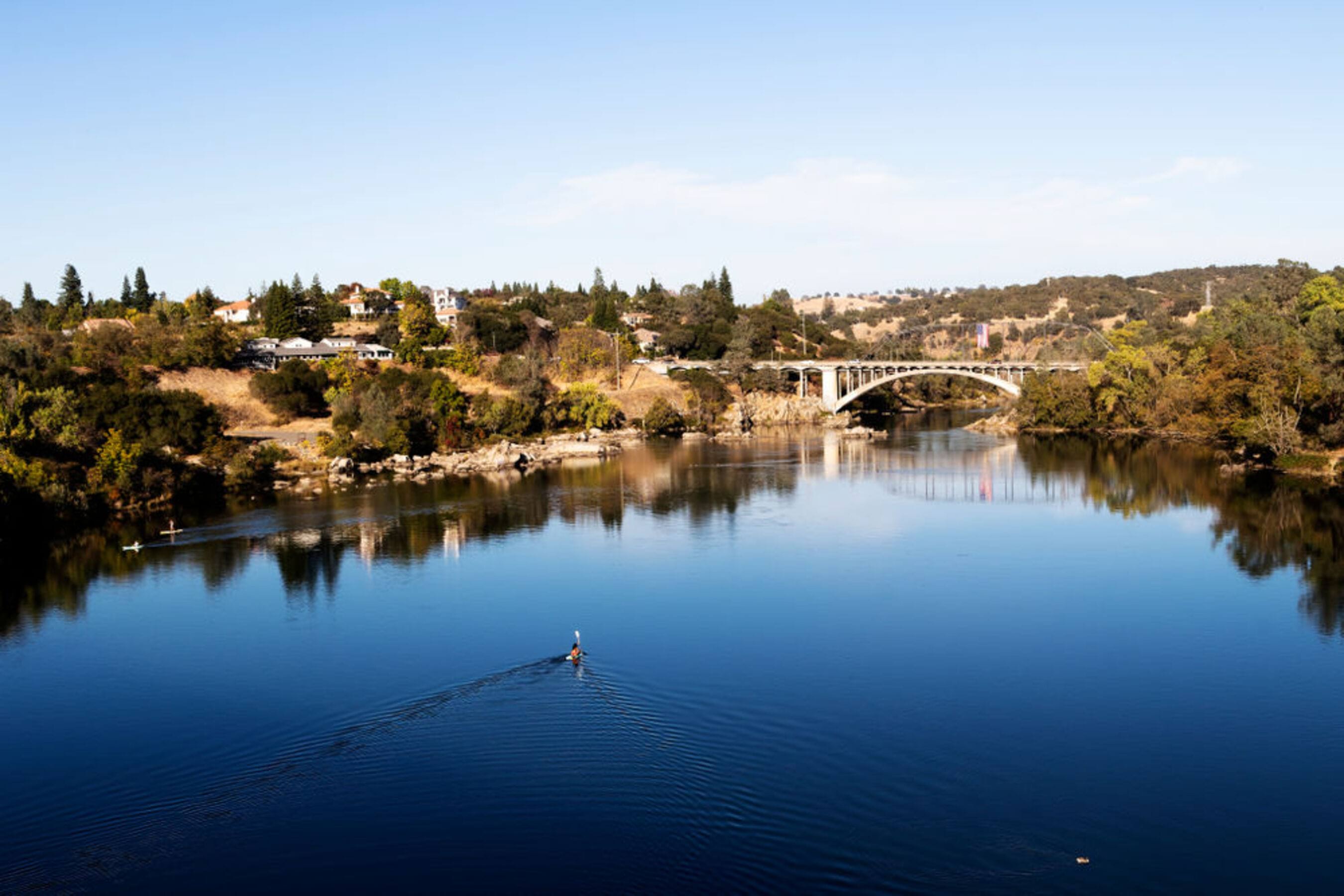 View of the lake on a beautiful day at Lake Pointe Apartments in Folsom, California