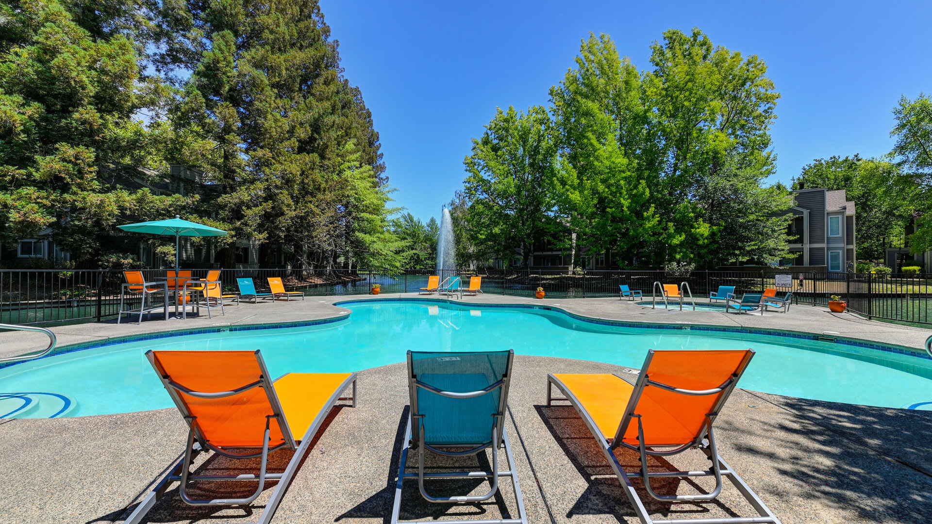 Poolside seating at Harbor Oaks Apartments in Sacramento, California