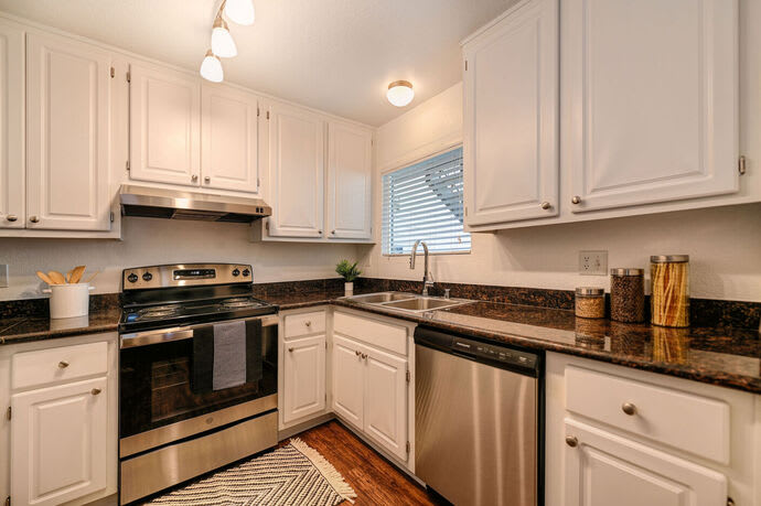 Kitchen with upgraded appliances at Harbor Oaks Apartments in Sacramento, California