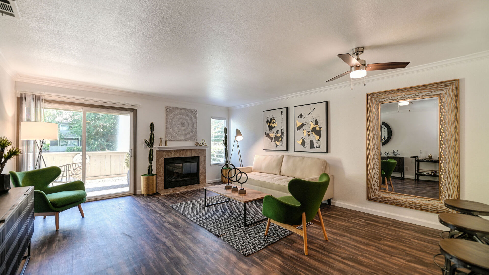 Model living room with wood floors at Harbor Oaks Apartments in Sacramento, California