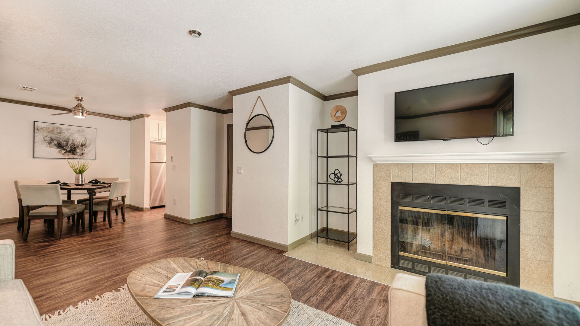 Open floor plan with wood style flooring at Harbor Oaks Apartments in Sacramento, California