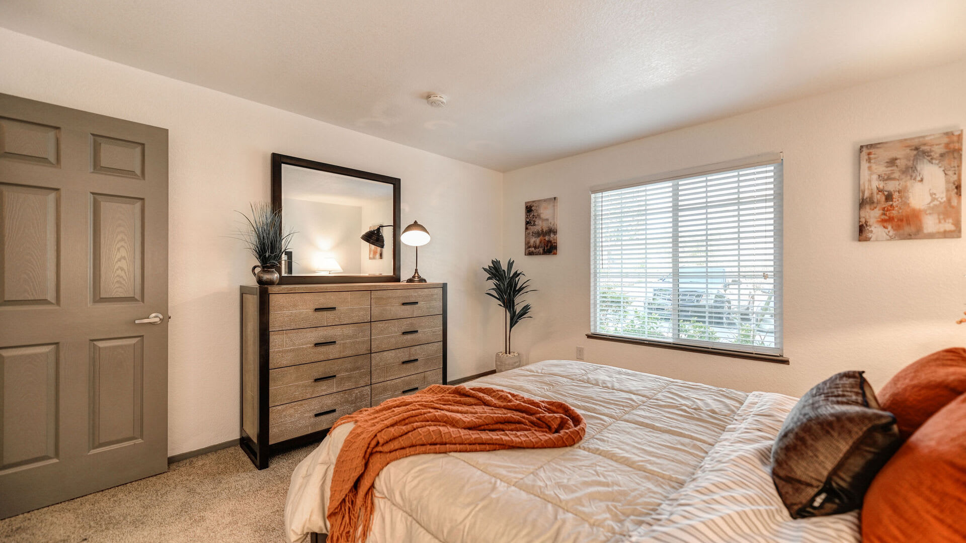 Model furnished bedroom at Harbor Oaks Apartments in Sacramento, California