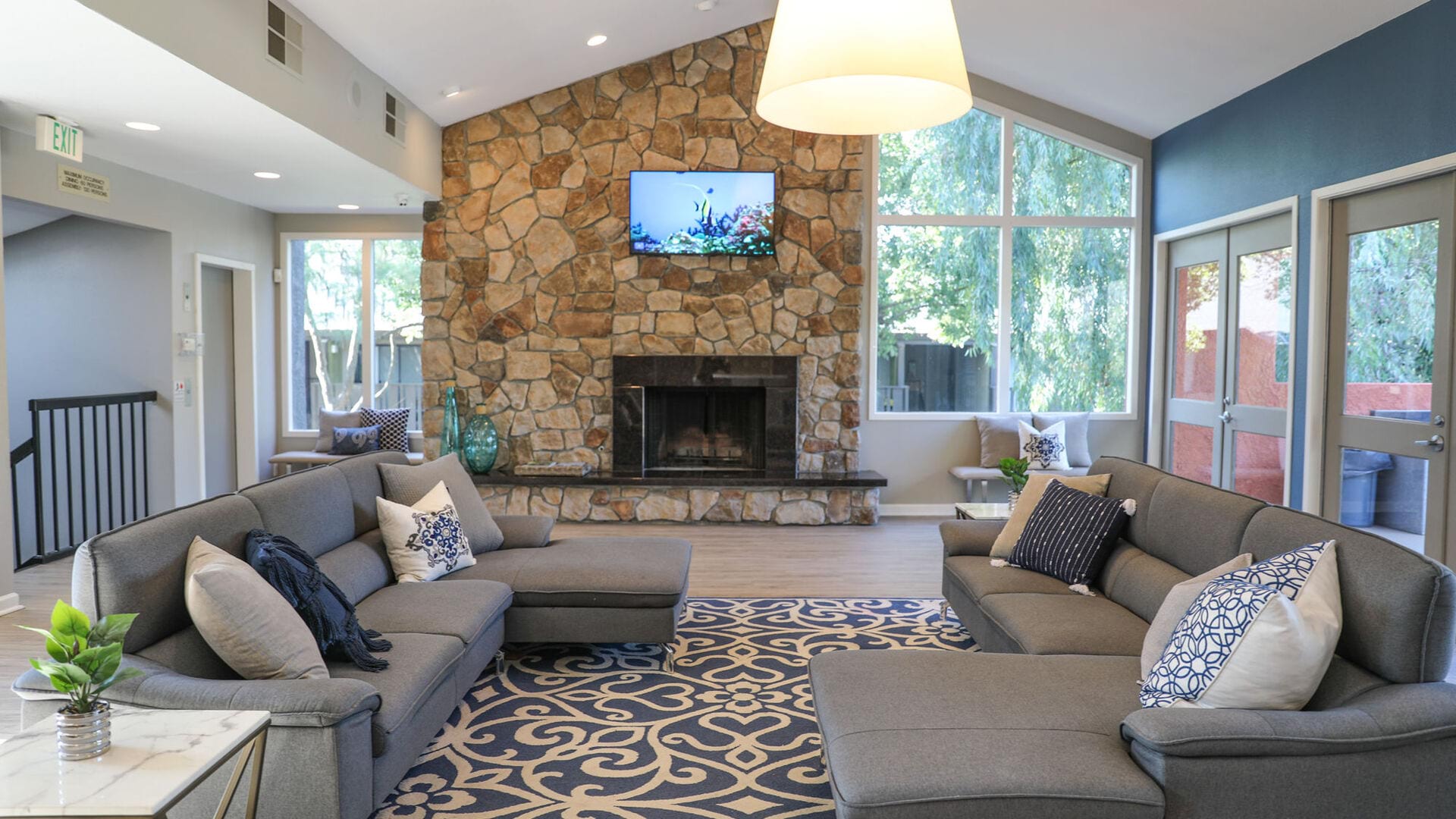 Tv room and fireplace in clubhouse at The Falls at Arden in Sacramento, California