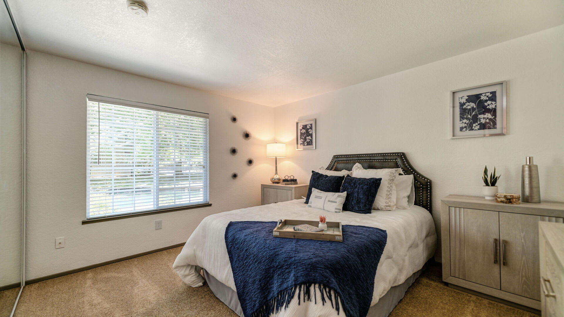 Model bedroom at Harbor Oaks Apartments in Sacramento, California