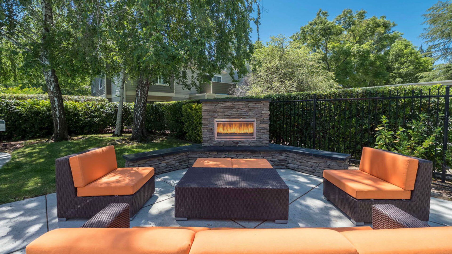 Outdoor lounge seating at Harbor Oaks Apartments in Sacramento, California