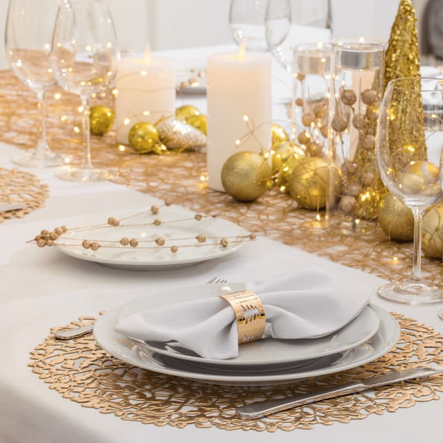 Elegant Table Setting with Gold Bulbs and Linens