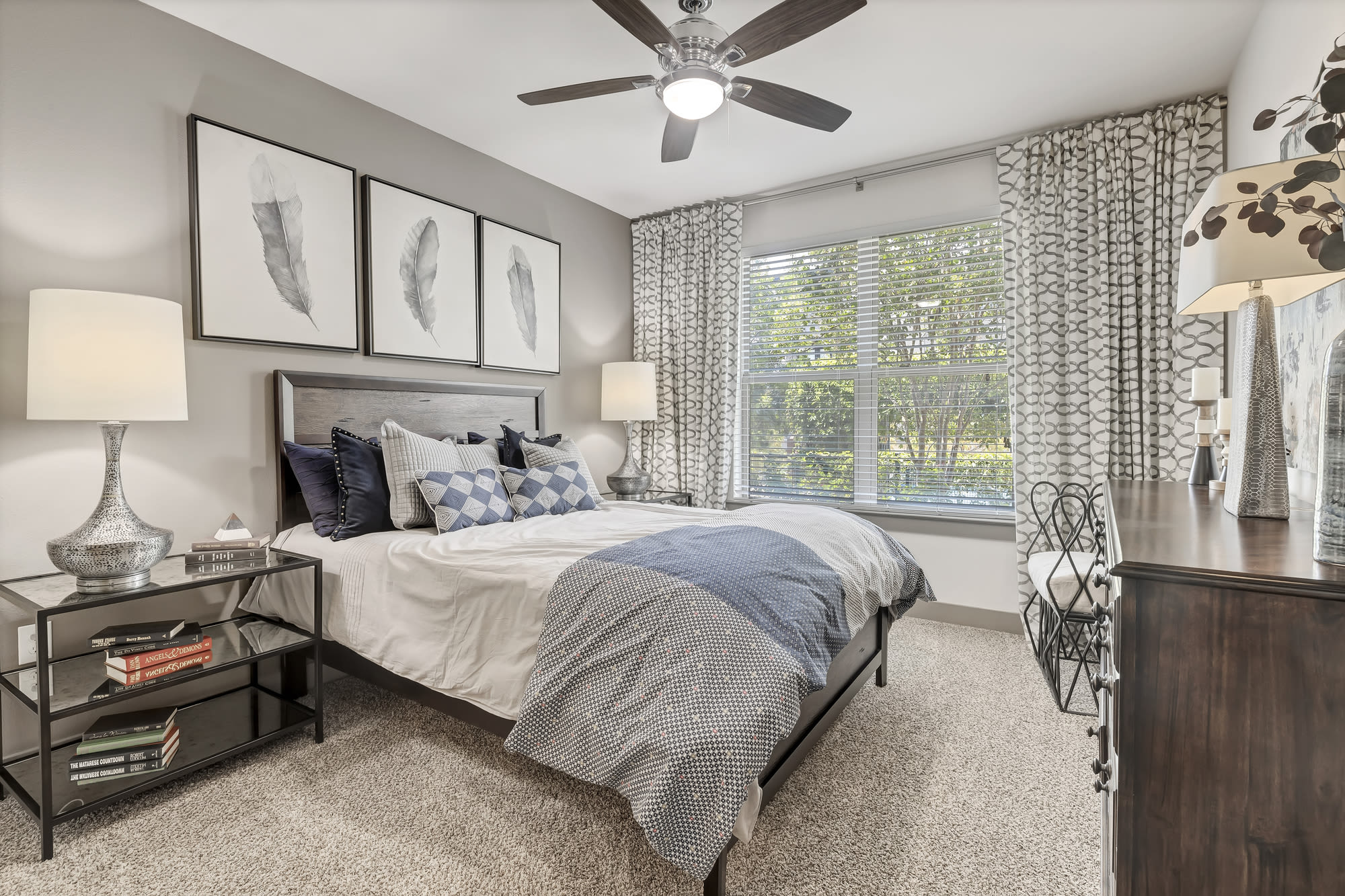 Bedroom with ceiling fan at Henley at The Rim in San Antonio, Texas