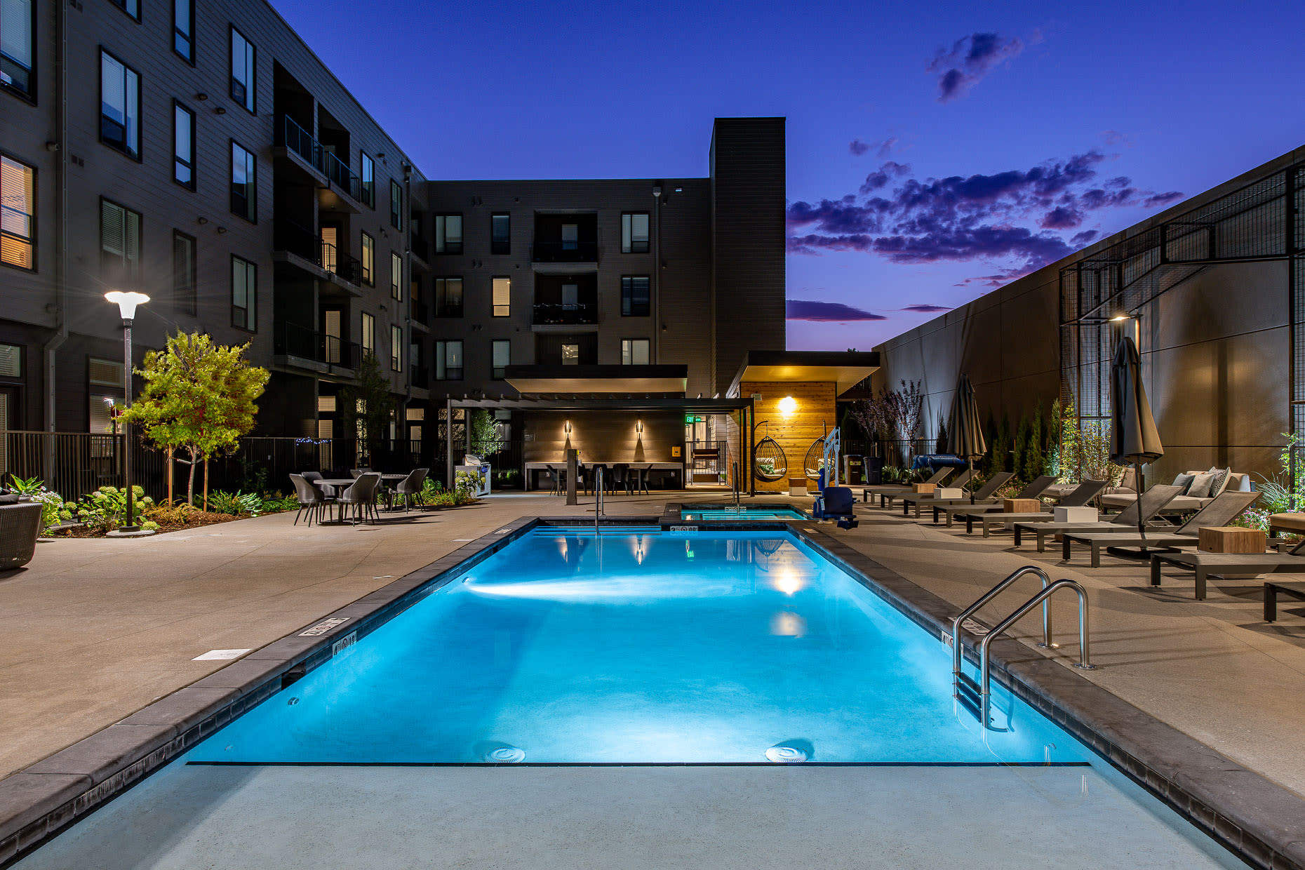 Front view of luxurious pool at night at  West 38 in Wheat Ridge, Colorado