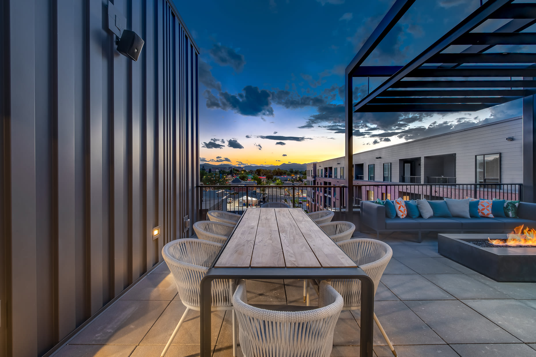 Outdoor firepit and patio area at sunset at  West 38 in Wheat Ridge, Colorado