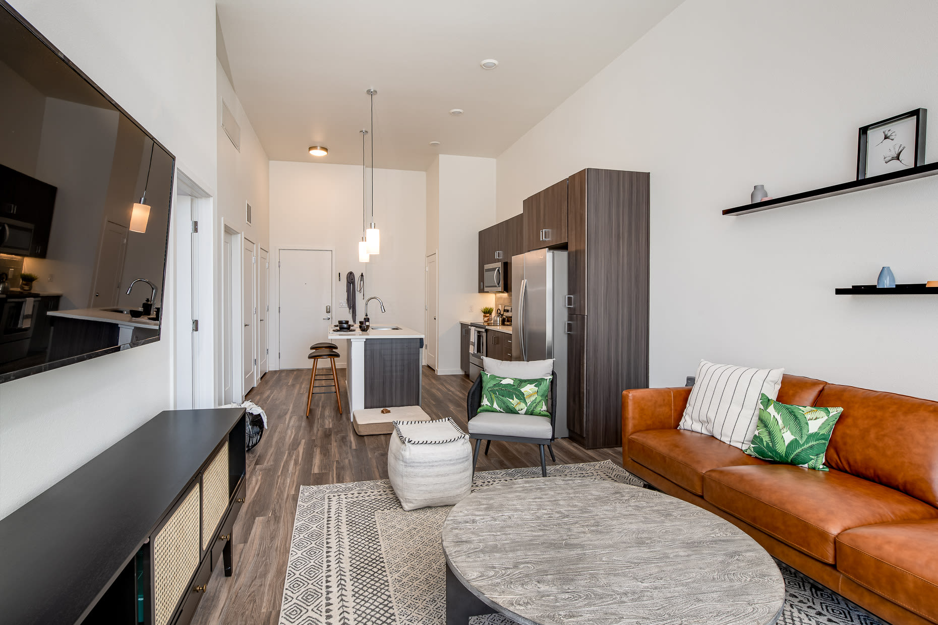 Living space with modern furniture in model home at West 38 in Wheat Ridge, Colorado