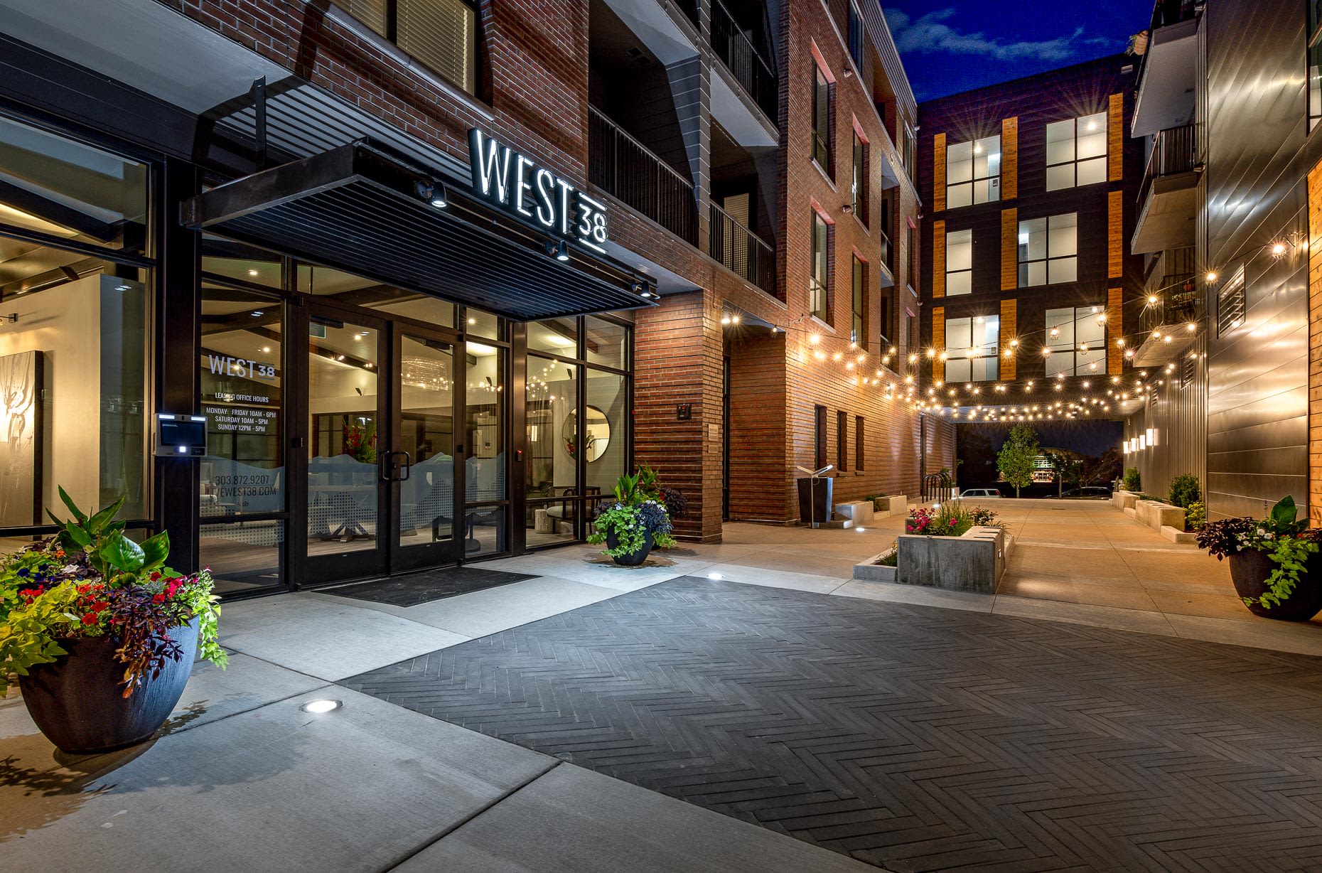 Side view of entrance at night  at West 38 in Wheat Ridge, Colorado