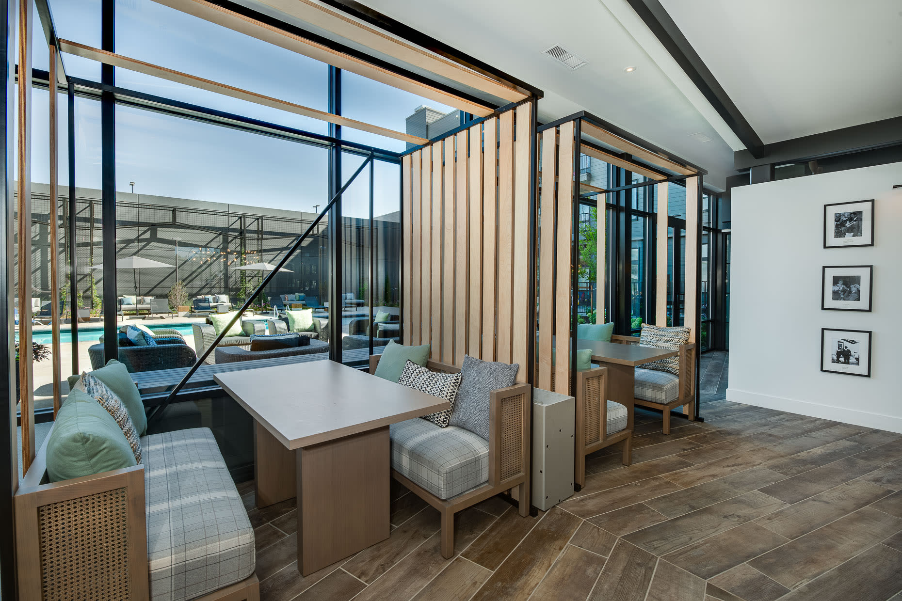 Sitting areas with tables to socialize in the clubhouse at West 38 in Wheat Ridge, Colorado