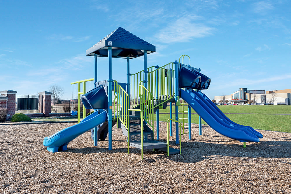 Apartments with a Playground equipped with a slide located at Lake Pointe Apartment Homes in Portage, Indiana