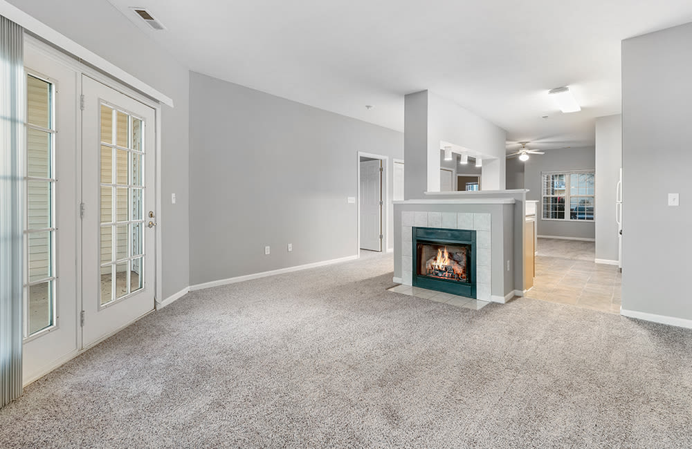 Living room with a fireplace at Lake Pointe Apartment Homes in Portage, Indiana