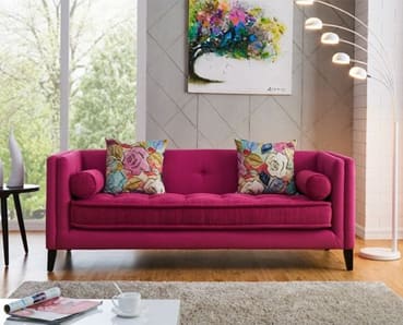 Magenta colored sofa
