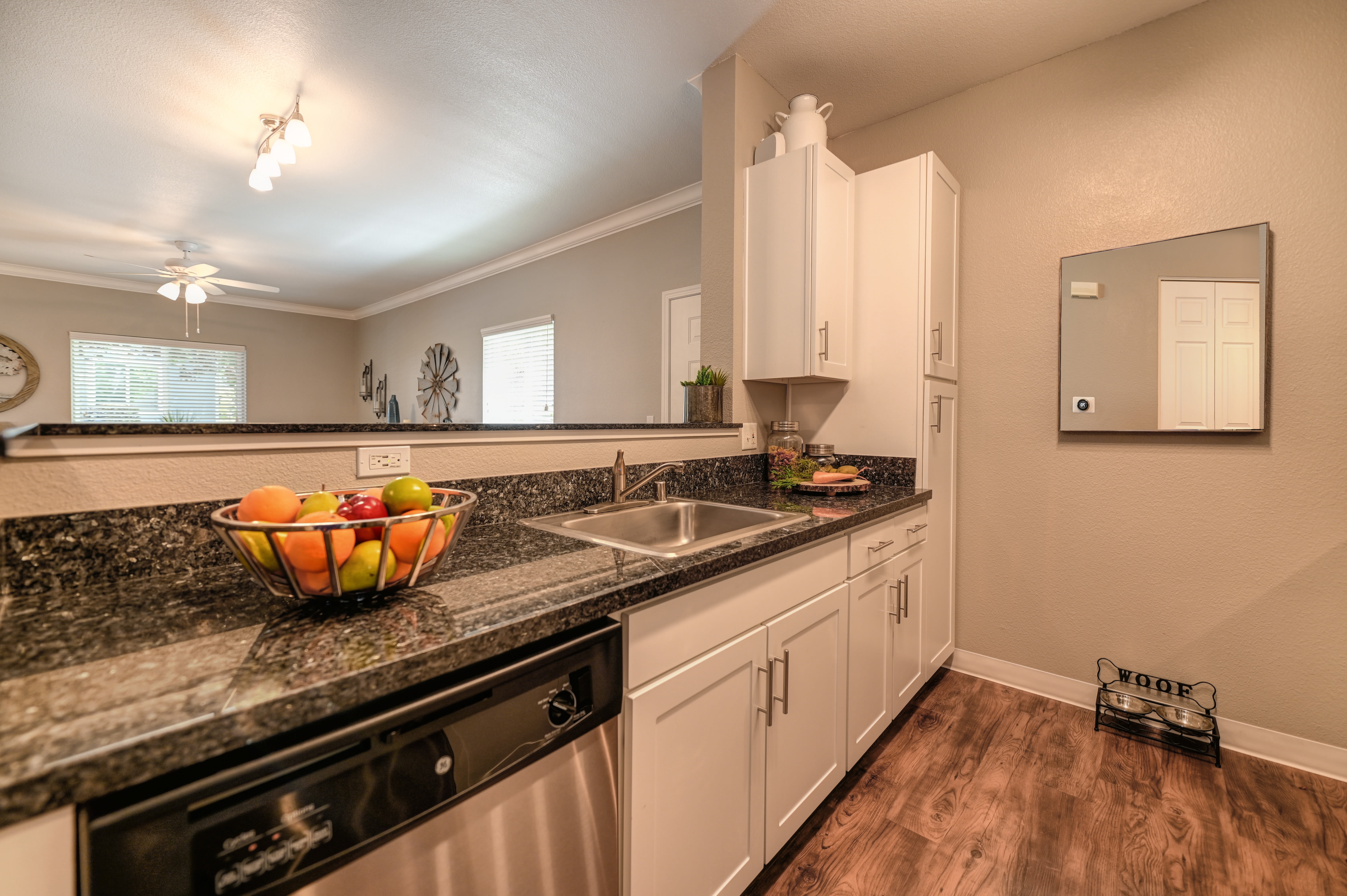 Model kitchen with a fruit bowl at Rocklin Ranch Apartments in Rocklin, California