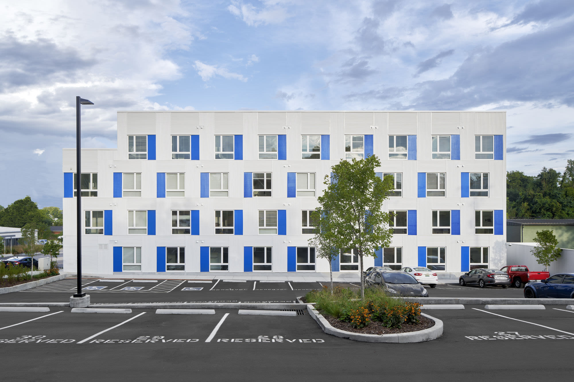 Exterior view of apartments with parking at Martin Flats in Nashville, Tennessee
