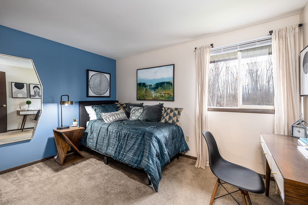 Beautifully designed bedroom at Raintree Island Apartments in Tonawanda, New York