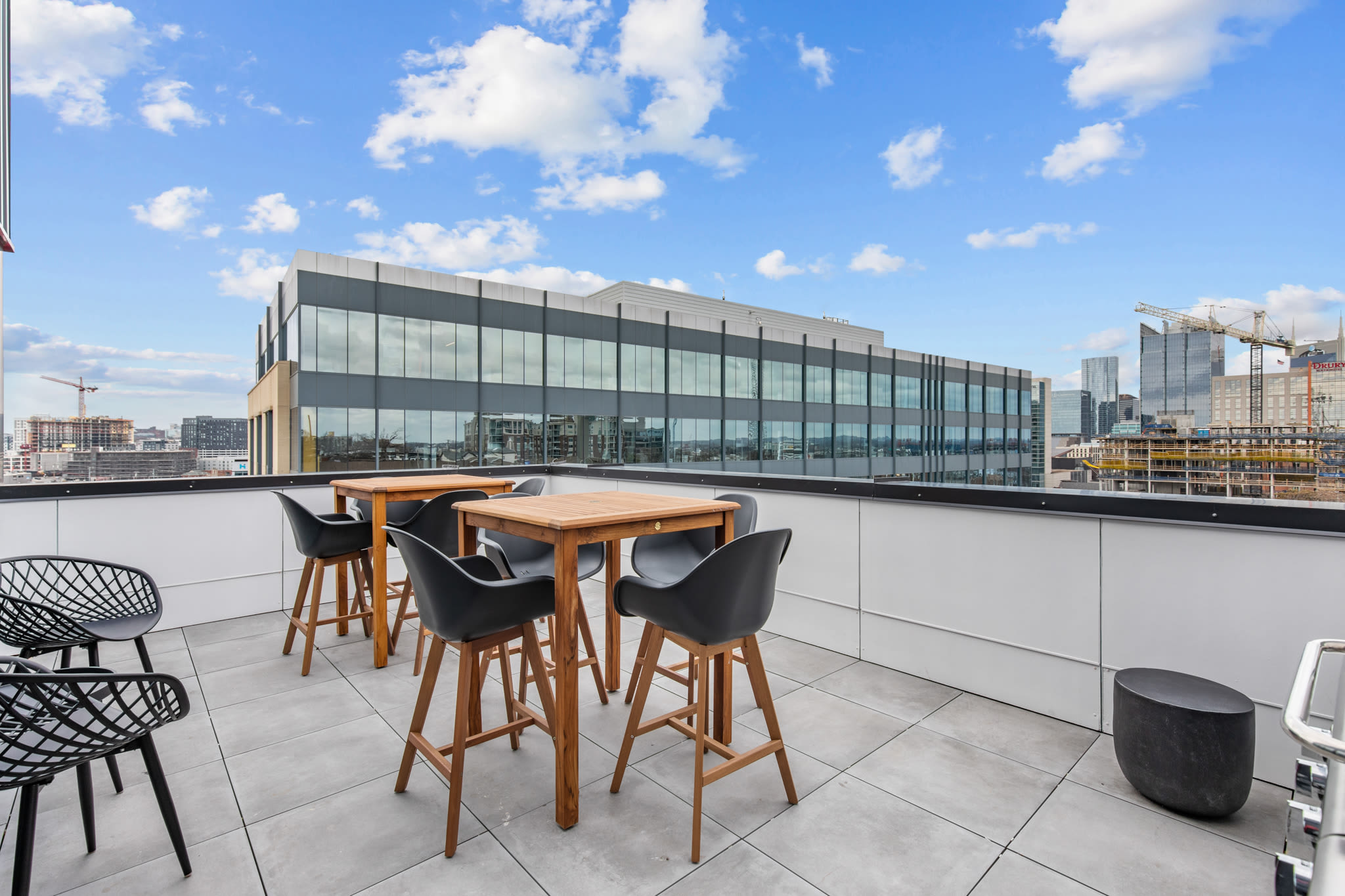 Terrace with Various Seating, Tables, and a Grill at Rutledge Flats in Nashville, Tennessee