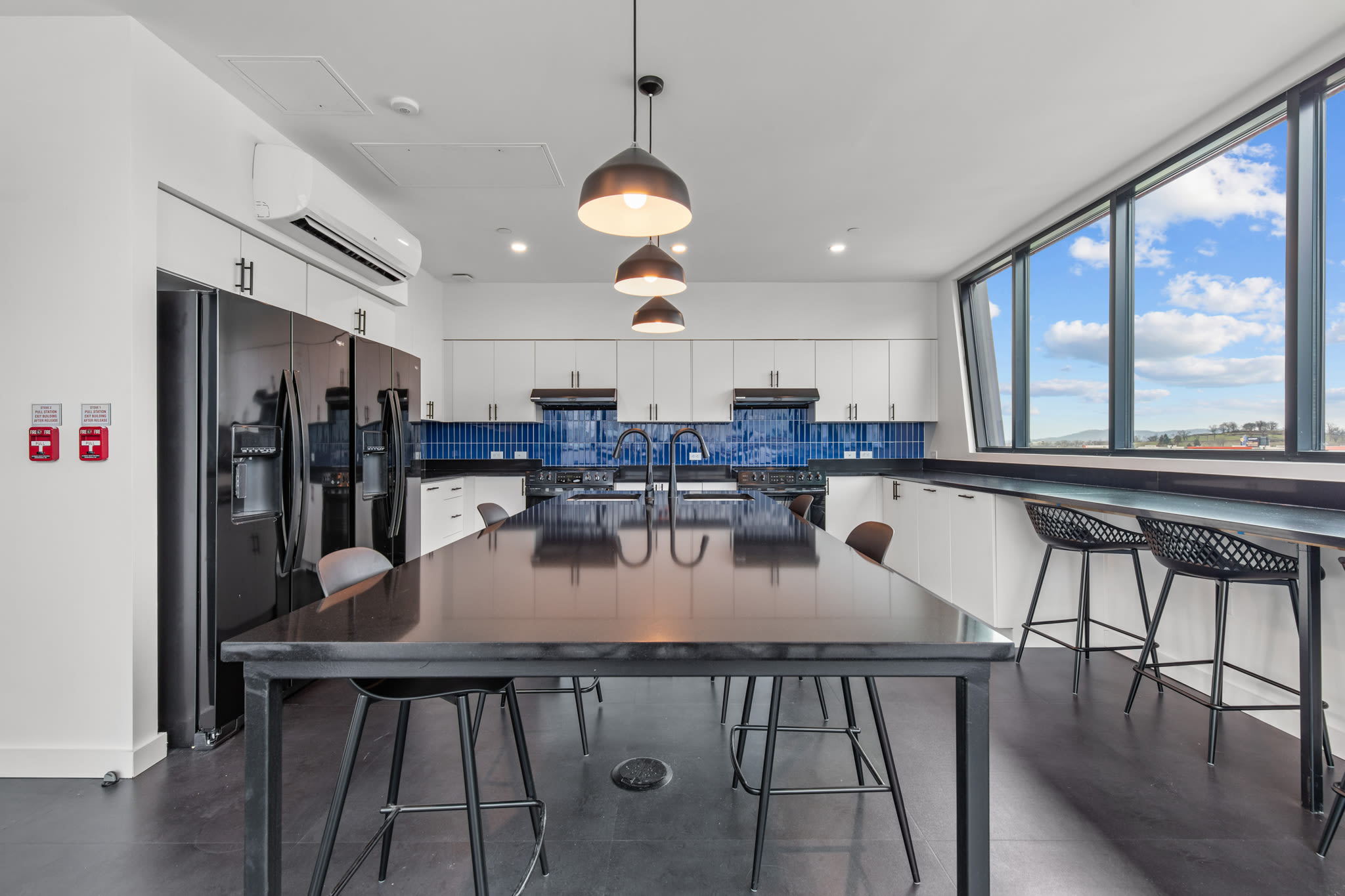 Community kitchen with appliance at Rutledge Flats in Nashville, Tennessee