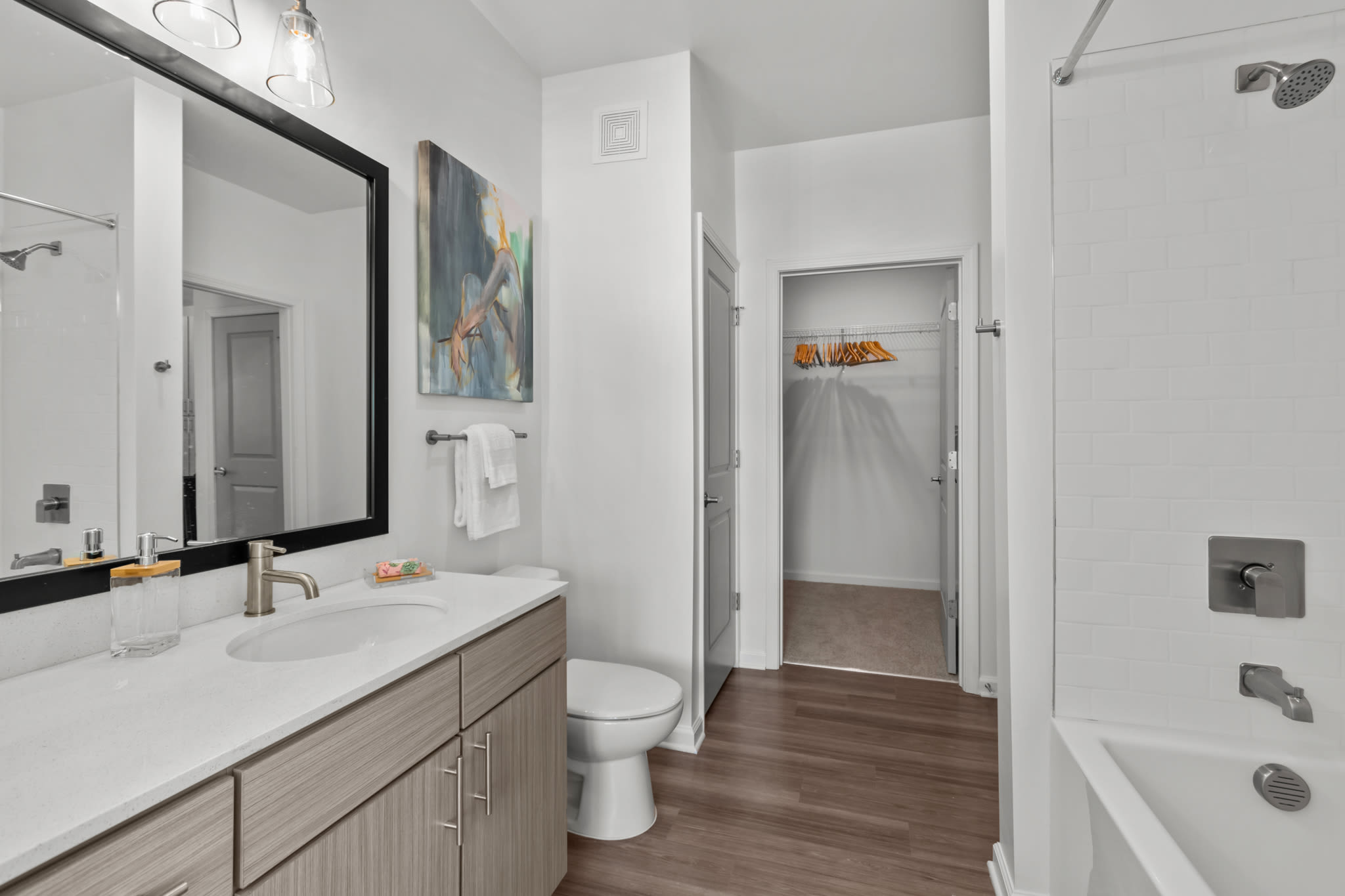 Bathroom and walk-in closet at Palmilla | Apartments & Townhomes in Pensacola, Florida