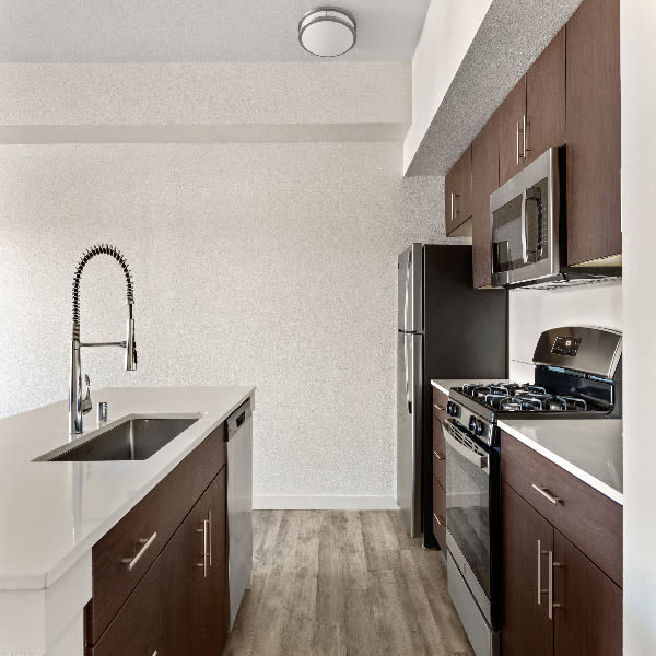 Clean kitchen with faucet at Morada Crossings in Stockton, California