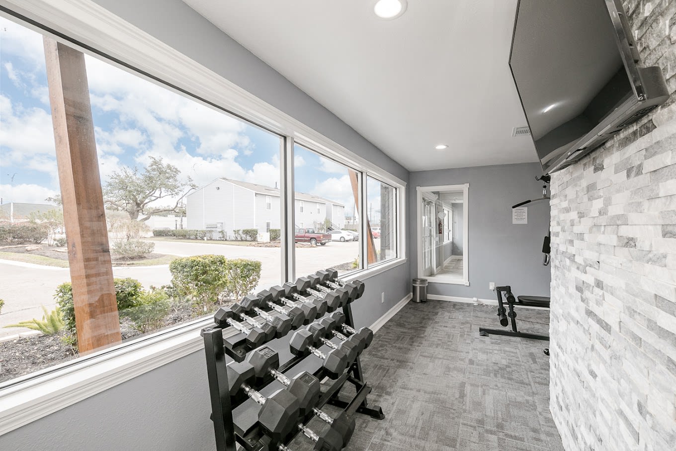 Fitness center with hand weights at Silvermine in Victoria, Texas