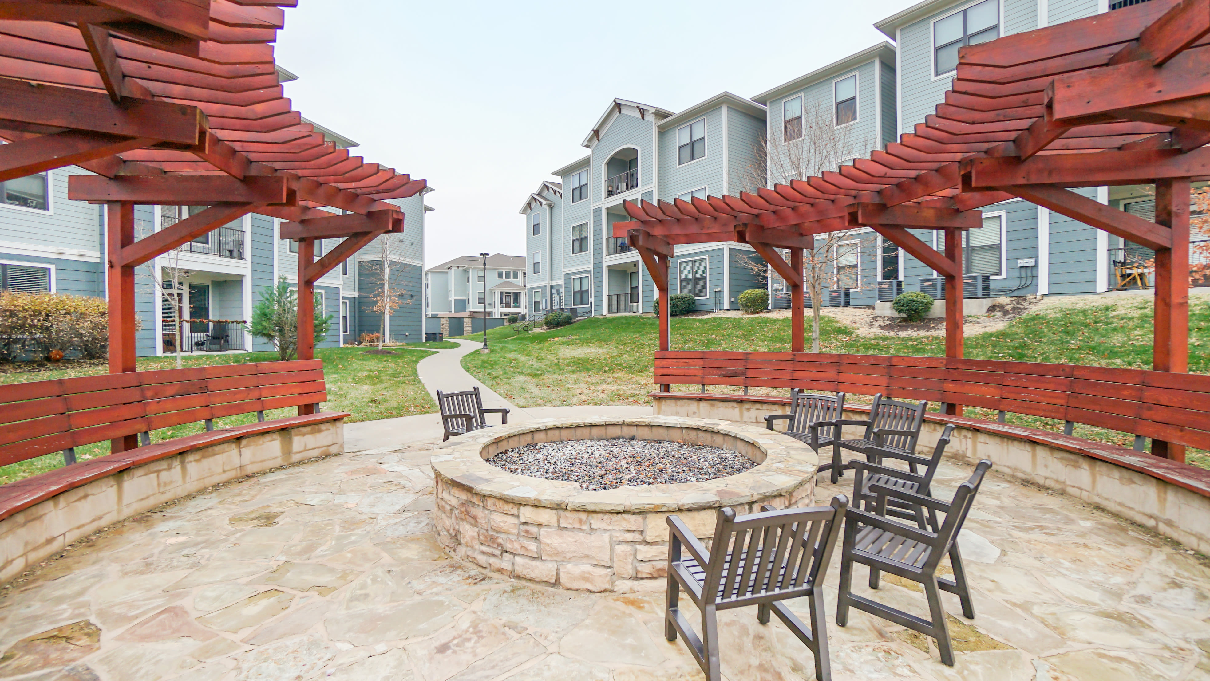 Patio area with wooden chairs at The Domain at Columbia in Columbia, MissouriP