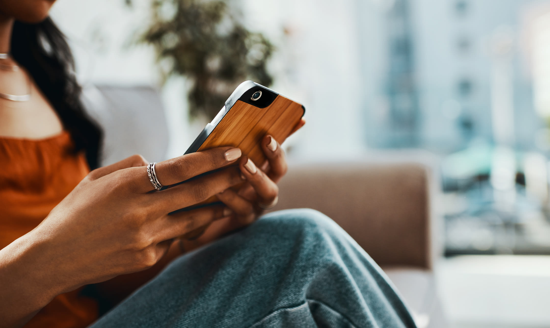 Resident using their phone at Metro Pointe in Baltimore, Maryland