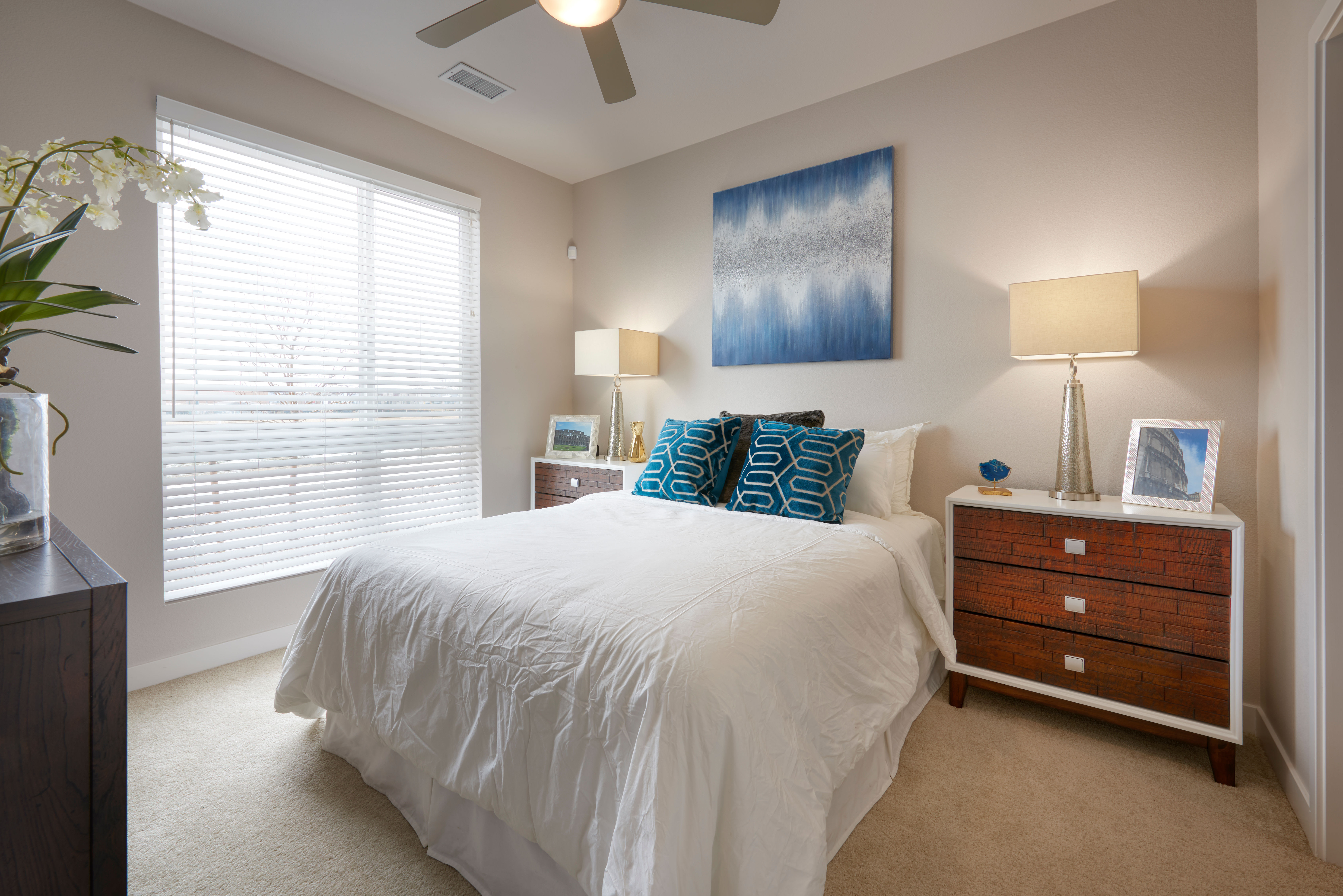 Bedroom with large windows at Strata Apartments in Denver, Colorado