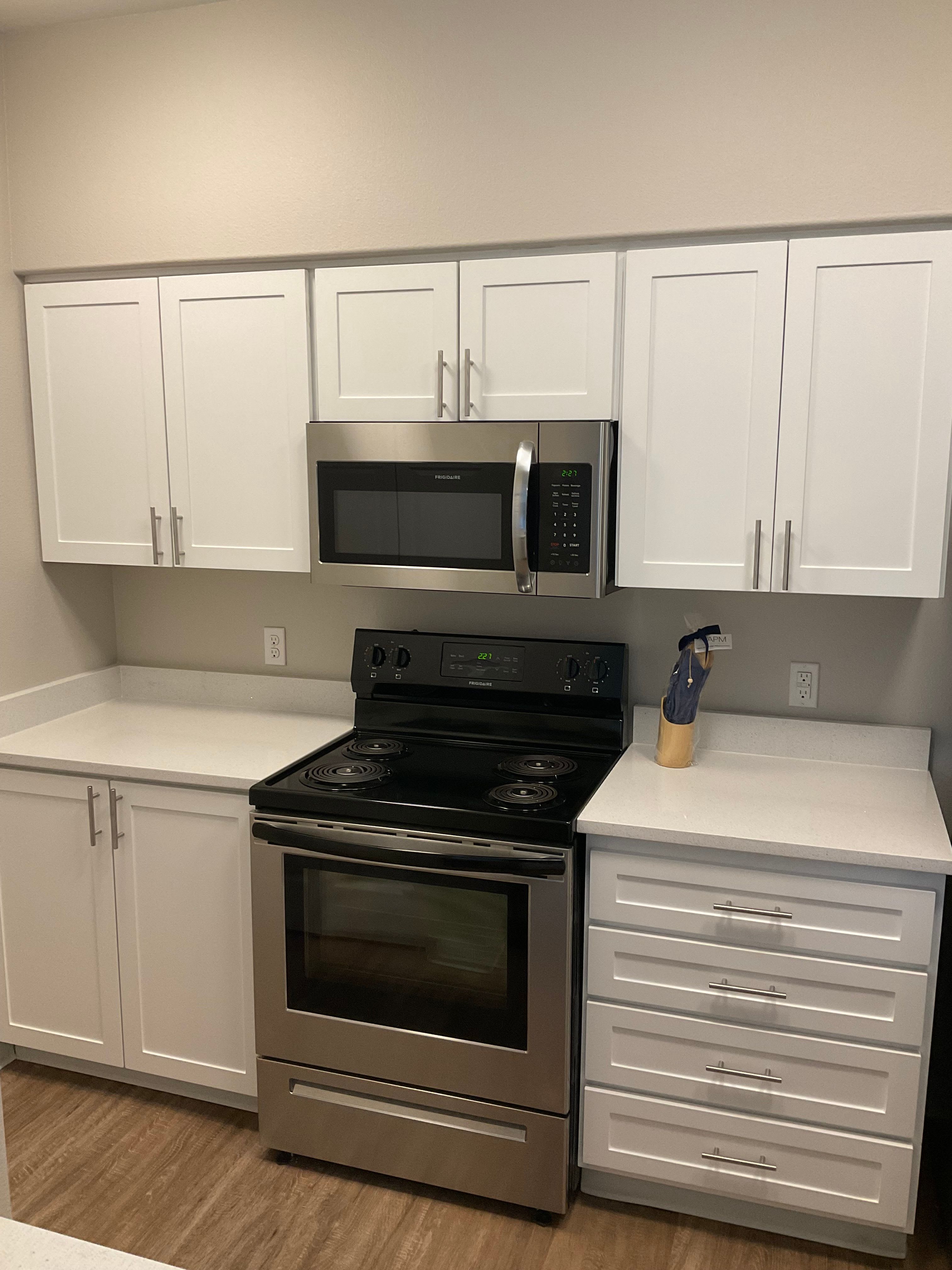 Our Renovated Apartments at Woodland Apartments in Olympia, Washington showcase a Kitchen