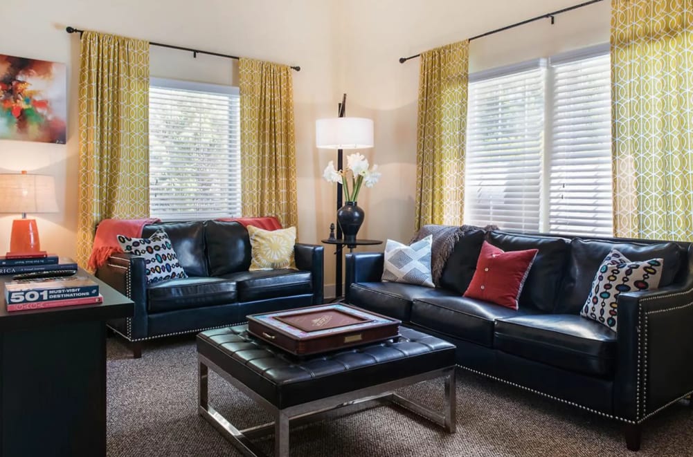 Model living room with leather couches at St. Andrews and The Villas at Little Turtle in Westerville, Ohio
