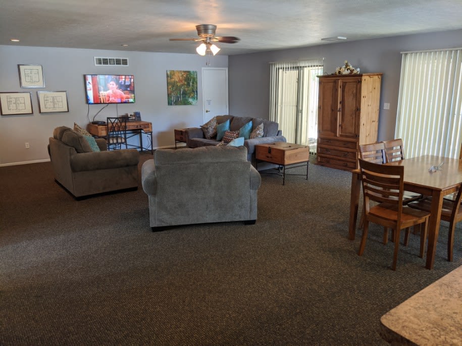 Clubhouse with couches and a dining table at North River Place in Chillicothe, Ohio
