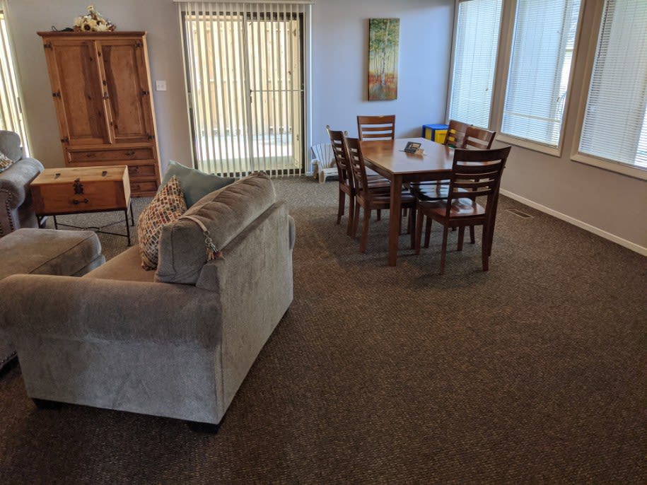 Community lounge area with a dining table at North River Place in Chillicothe, Ohio