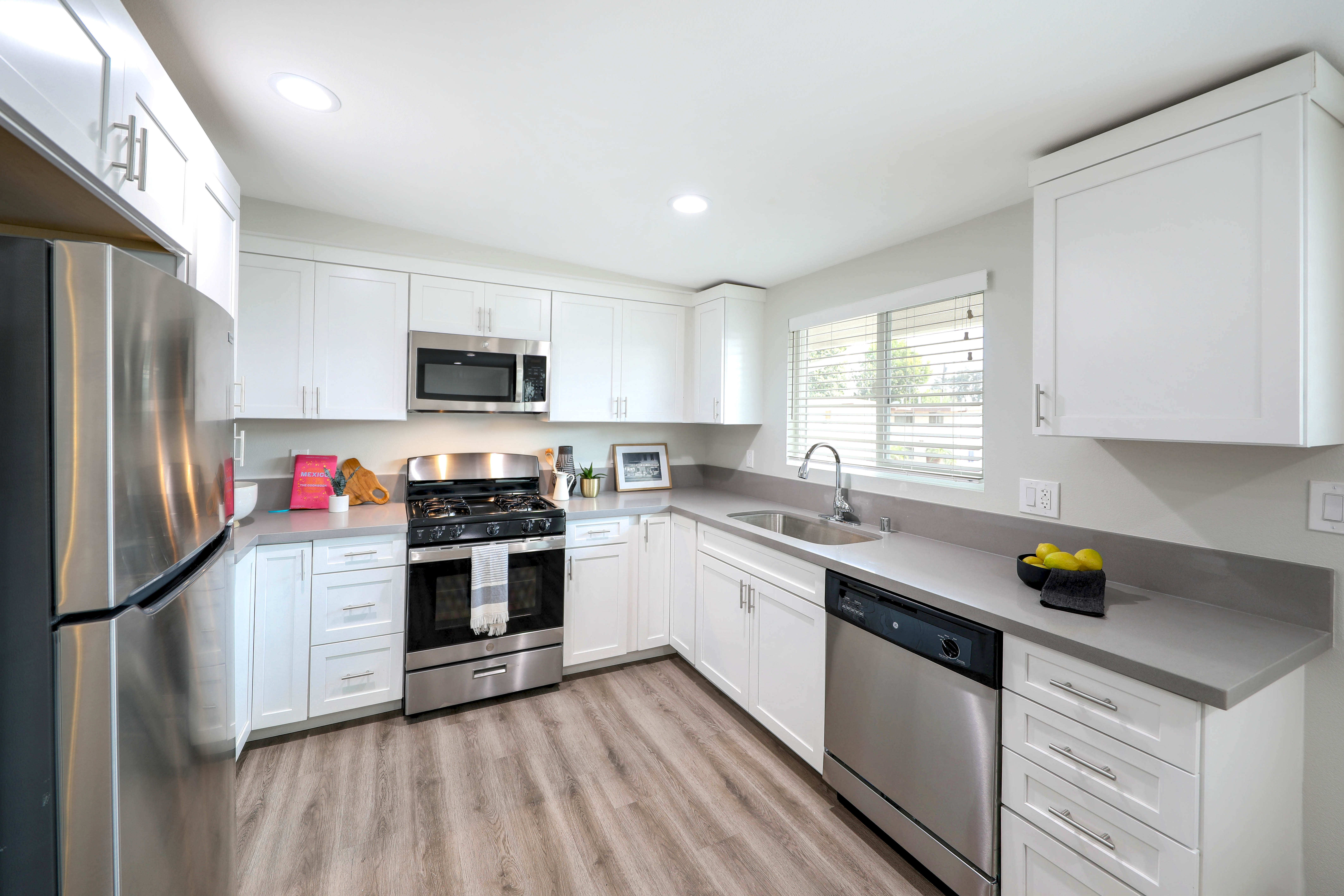 Stainless-steel appliances in a bright kitchen at Pacific West Villas in Westminster, California