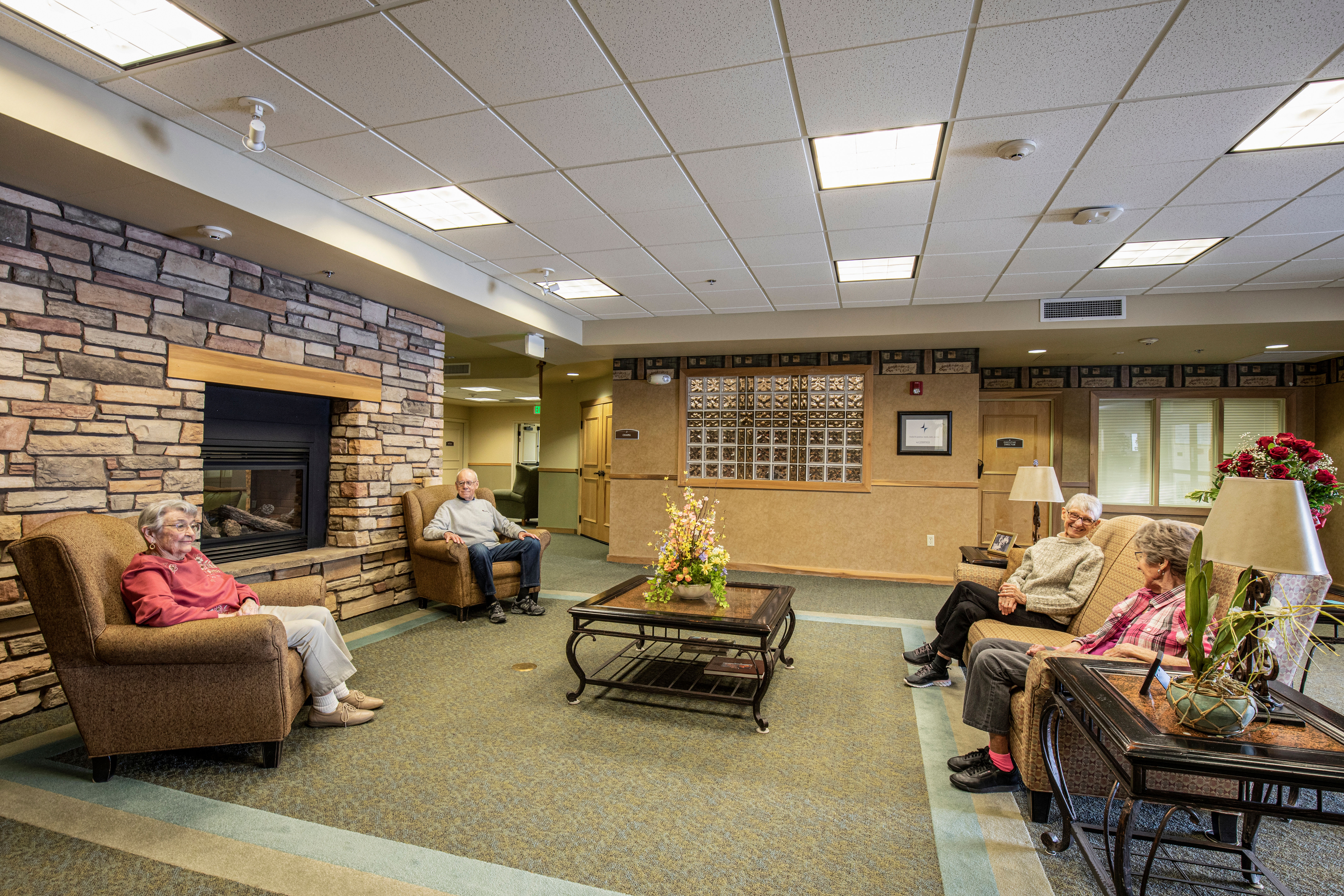 Elegant lounge complete with fireplace at Majestic Rim Retirement Living in Payson, Arizona. 