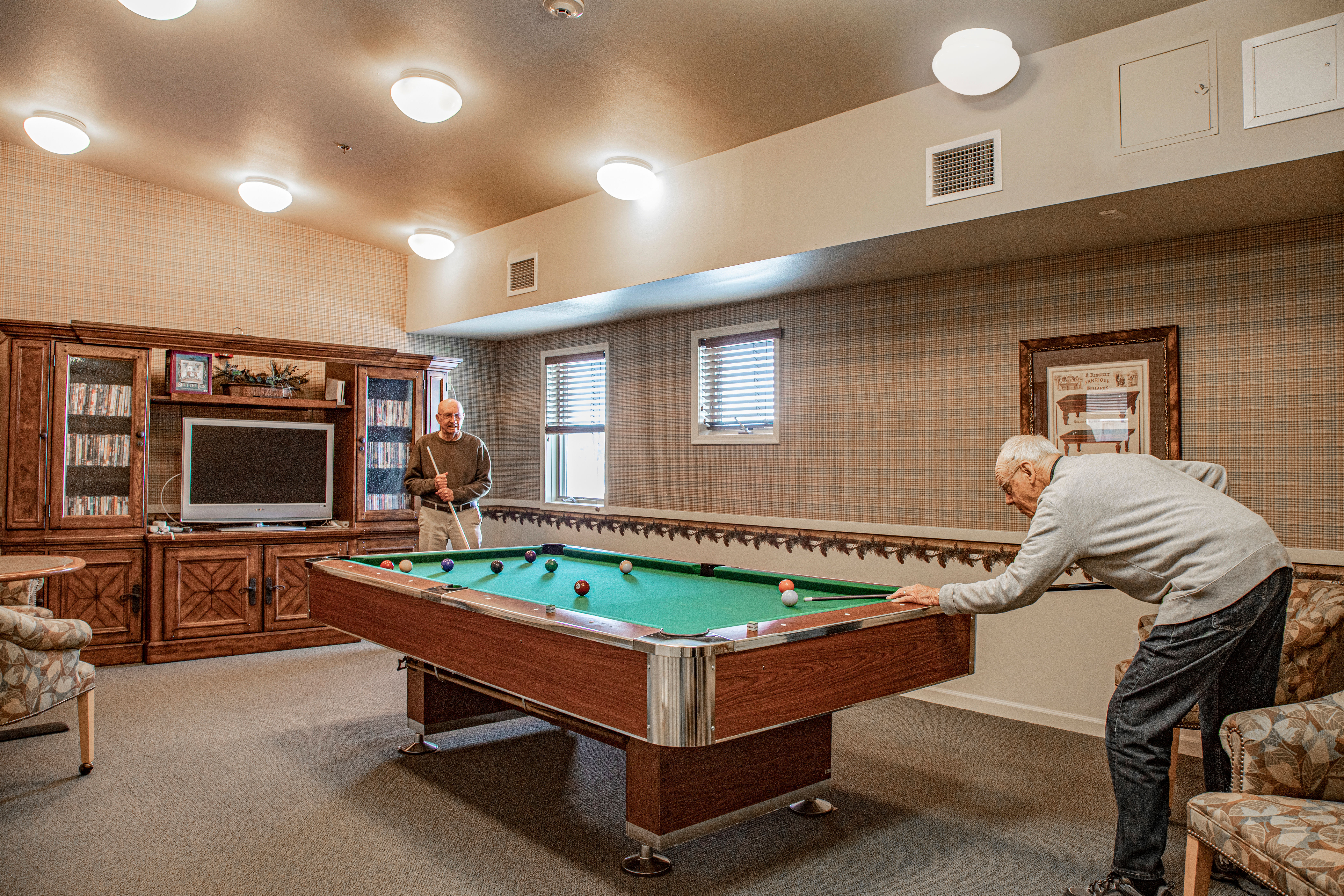 Game room complete with billiard table at Majestic Rim Retirement Living in Payson, Arizona. 