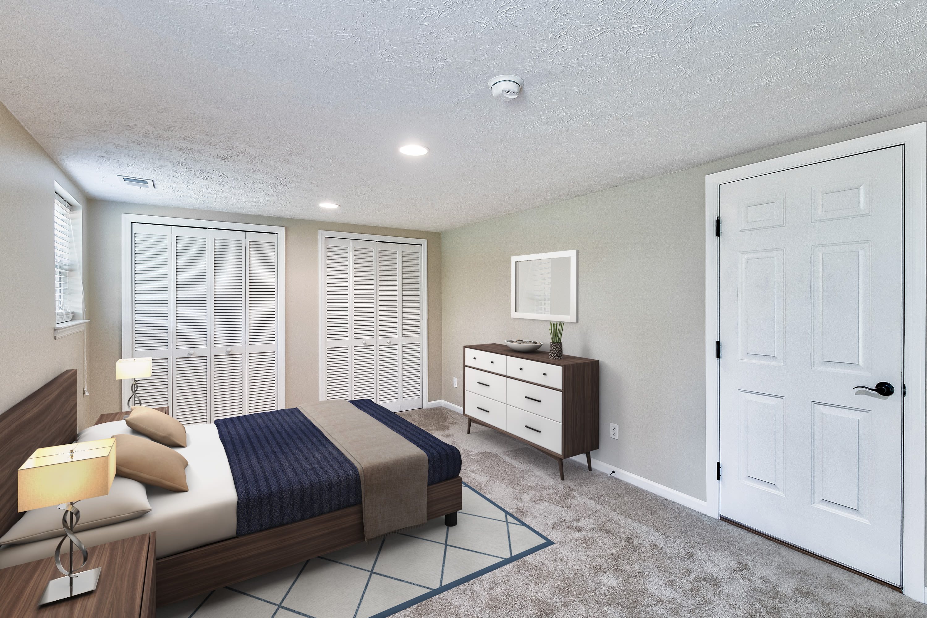 Comfy model bedroom at Seven Fields Apartments in Seven Fields, Pennsylvania