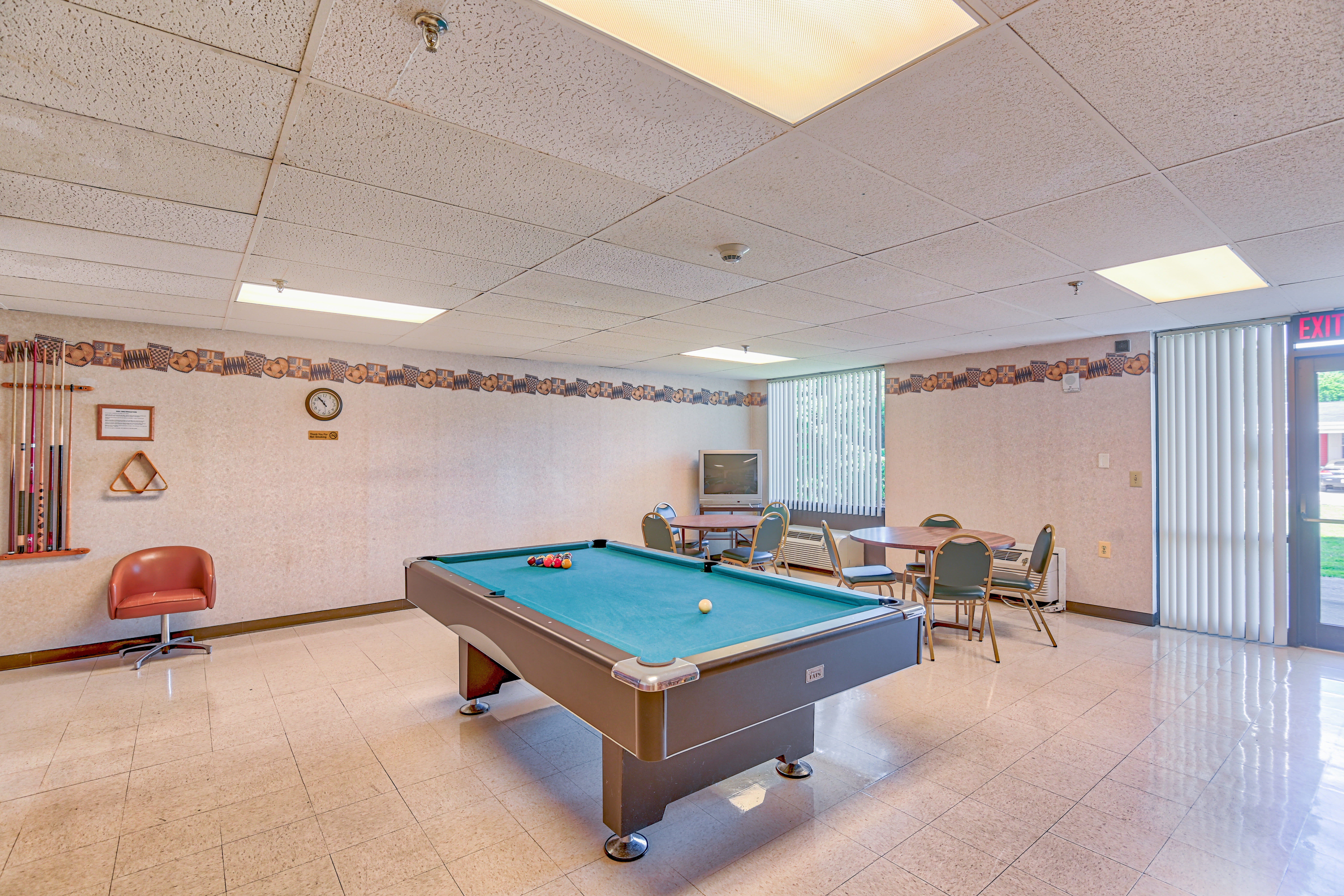 Community room with a pool table at Riverside Towers in Coshocton, Ohio