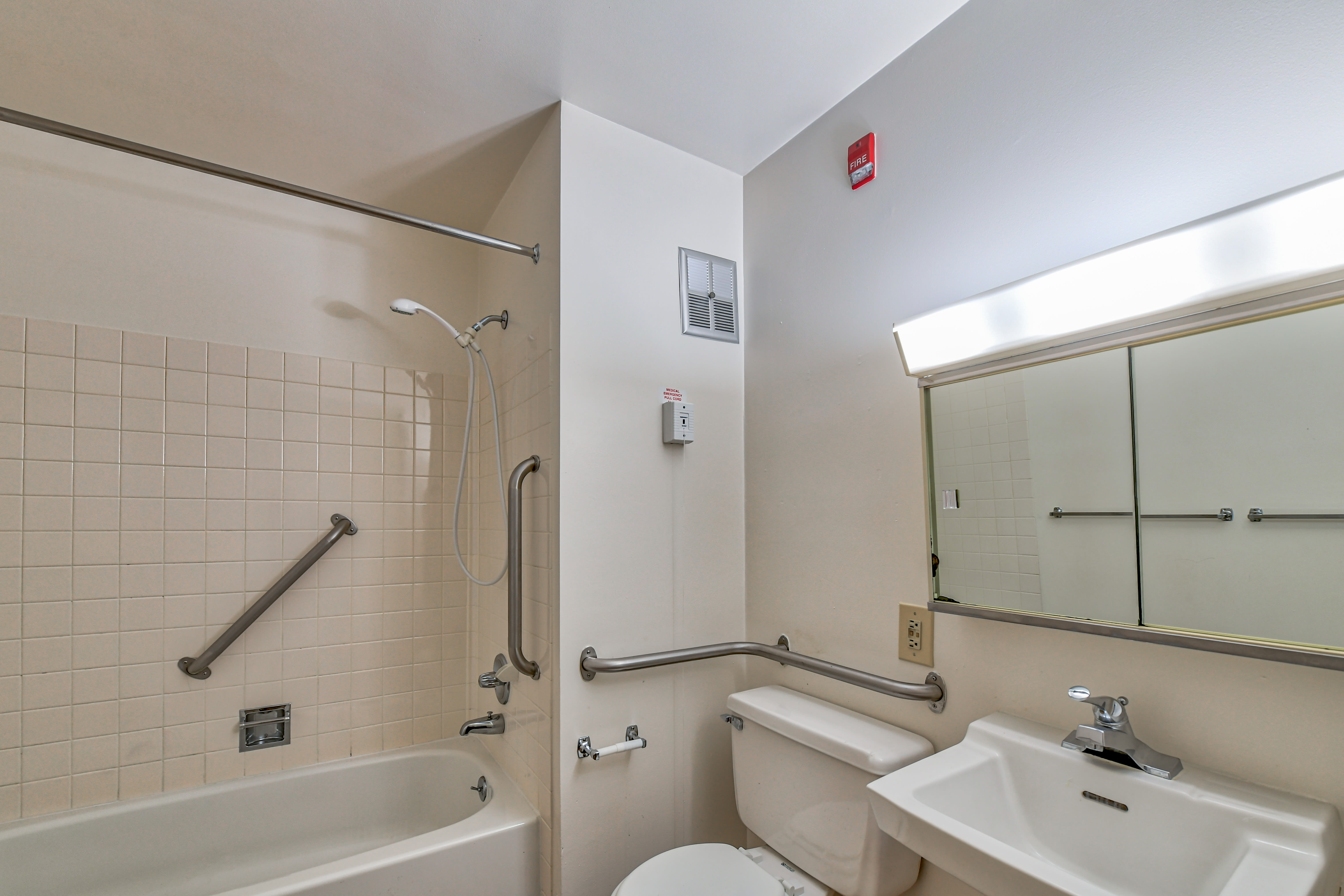 Bathroom with a vanity and tub/shower combination in a model home at Citizen's Plaza in New Kensington, Pennsylvania
