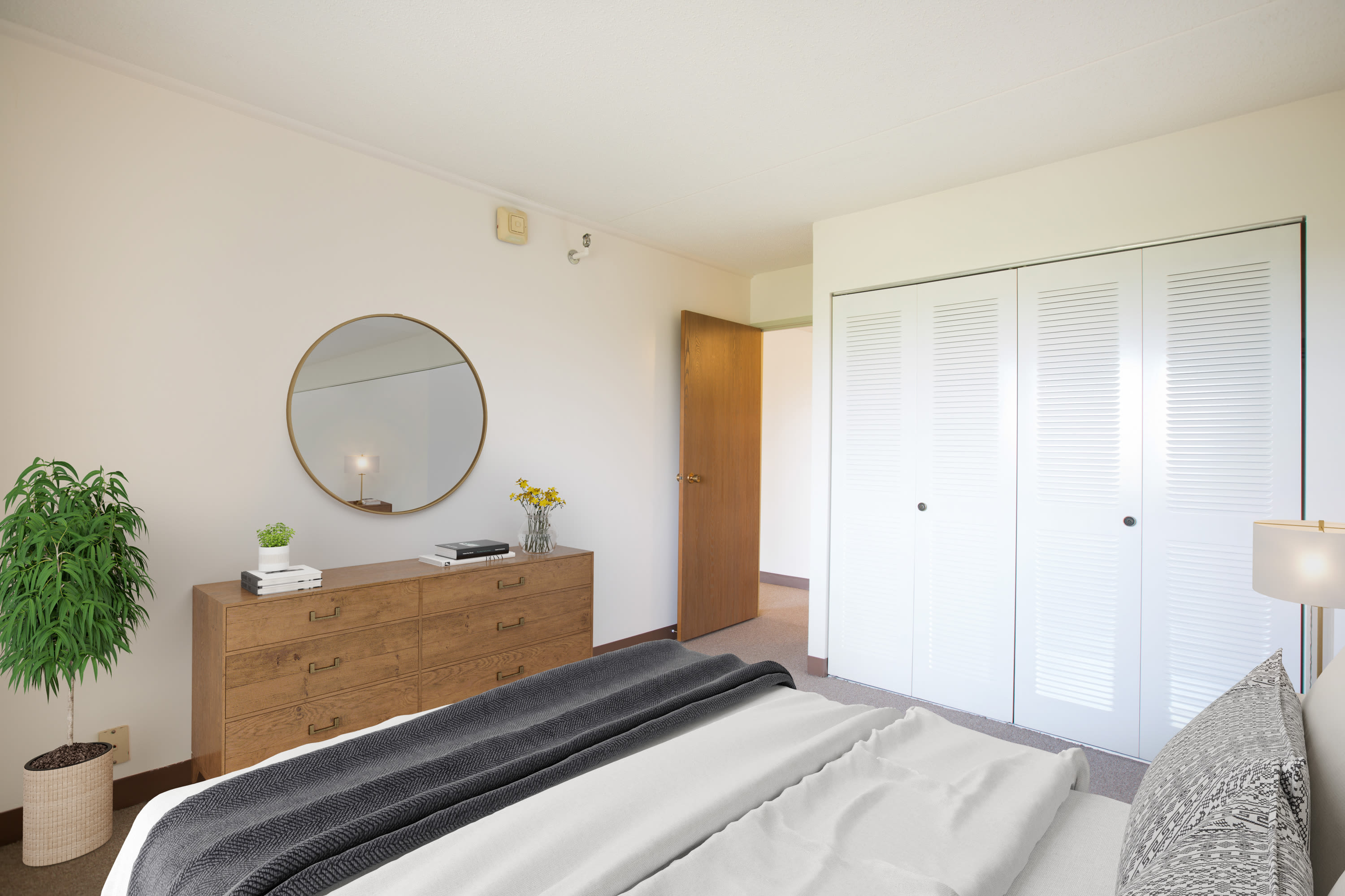 Master bedroom with white walls at Park Place Towers in Mount Clemens, Michigan