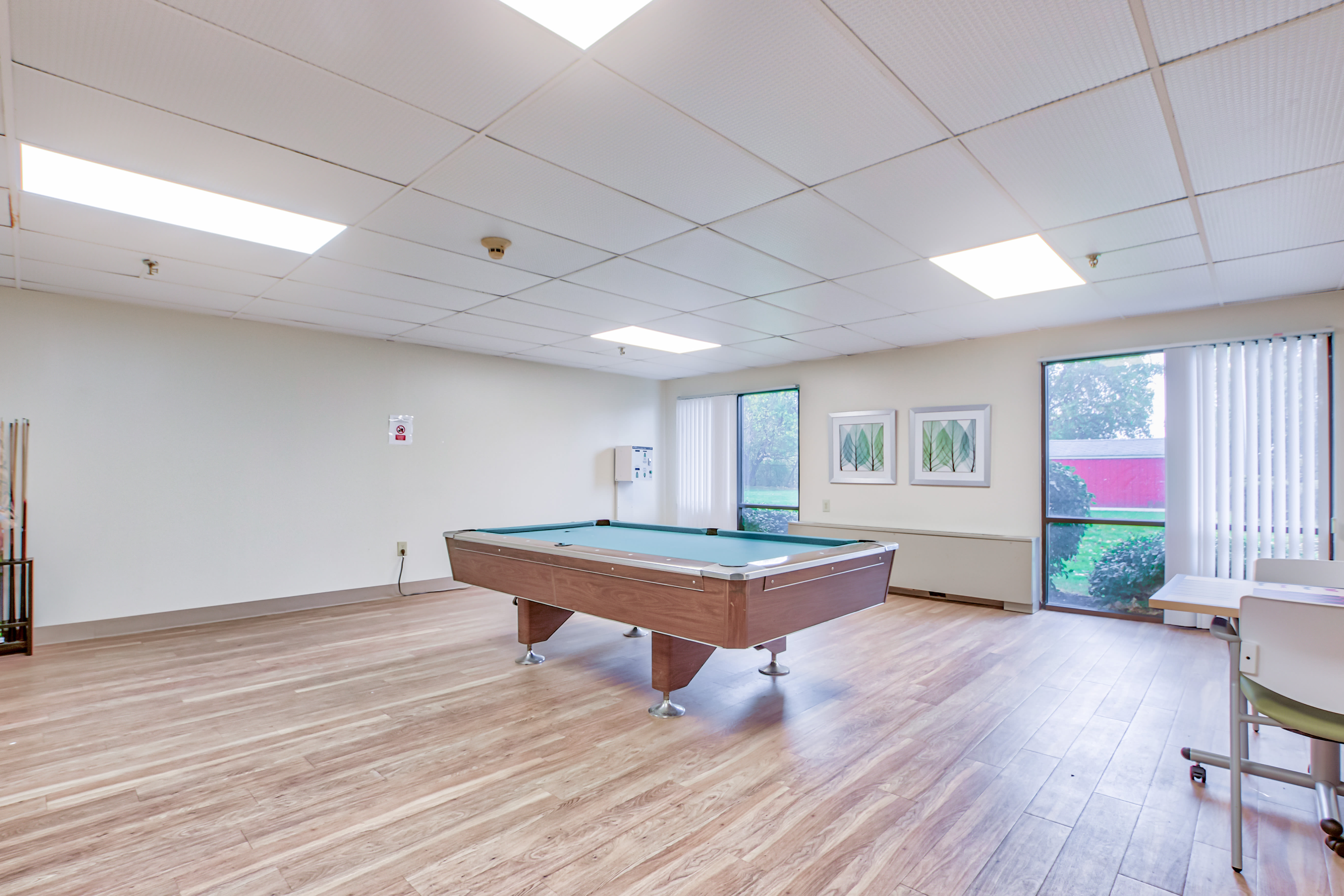 Community room with a pool table at Park Place Towers in Mount Clemens, Michigan