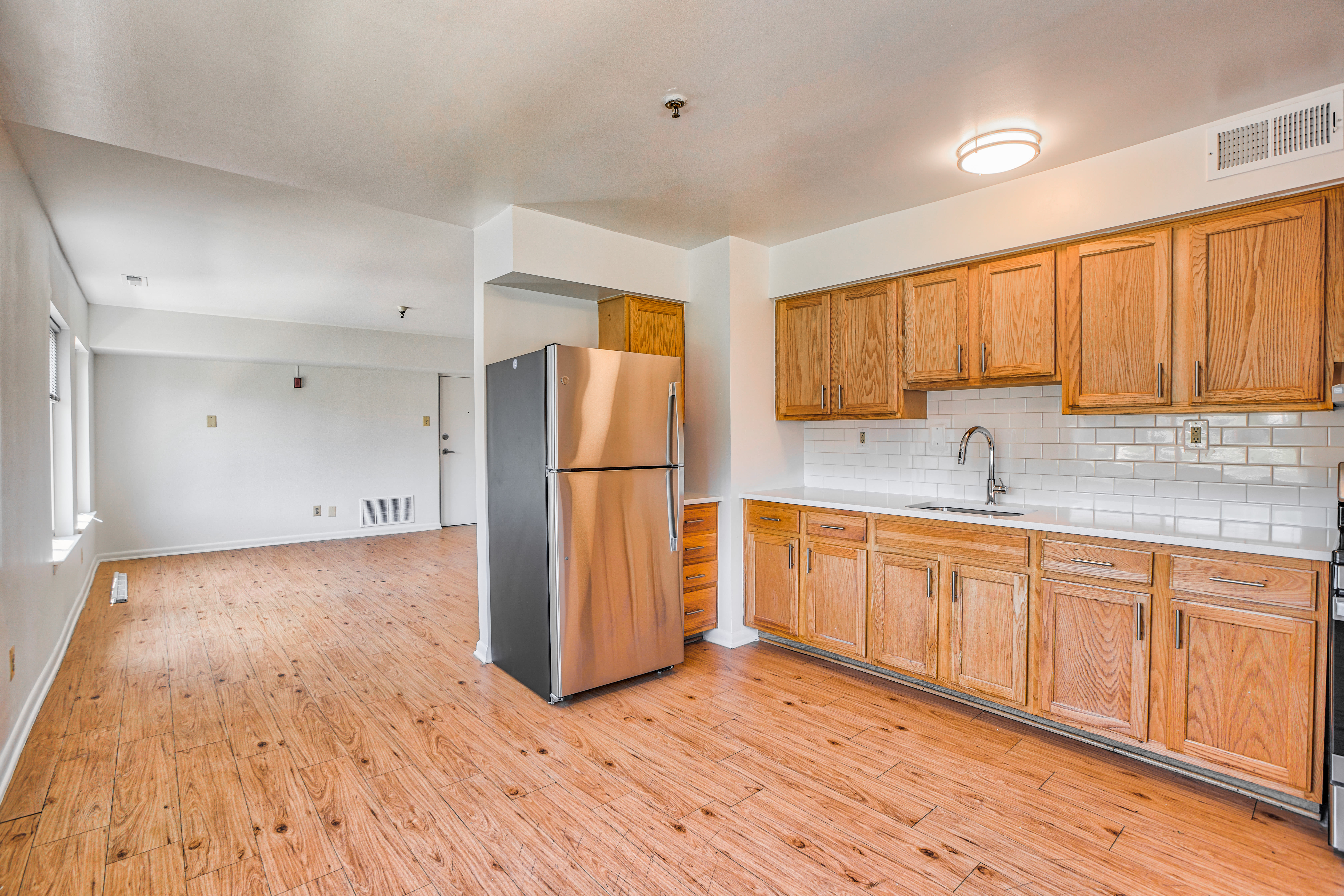 Model kitchen with wood floors at Bay Ridge Gardens in Annapolis, Maryland