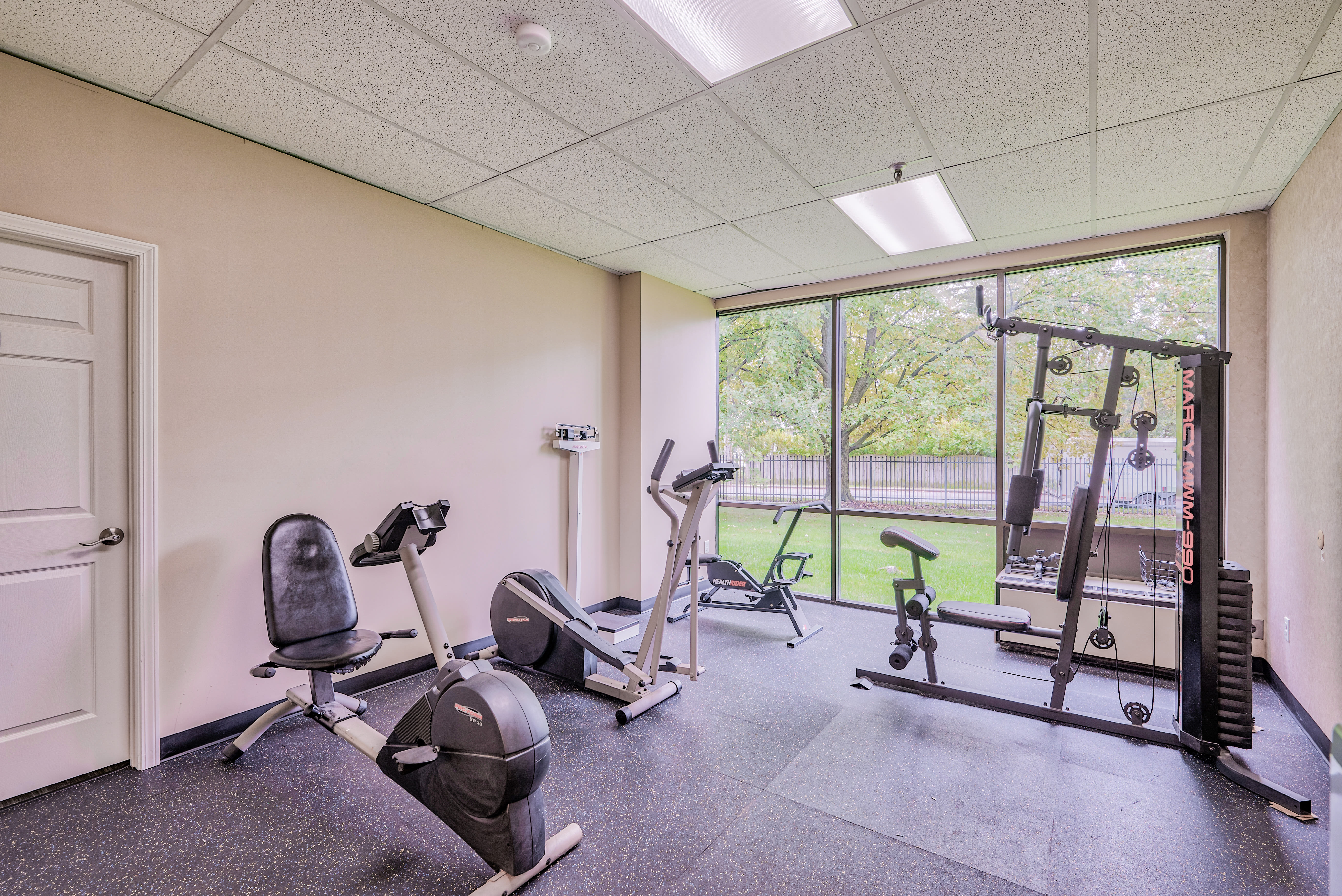 Resident gym with white walls at Towne Centre Place in Ypsilanti, Michigan