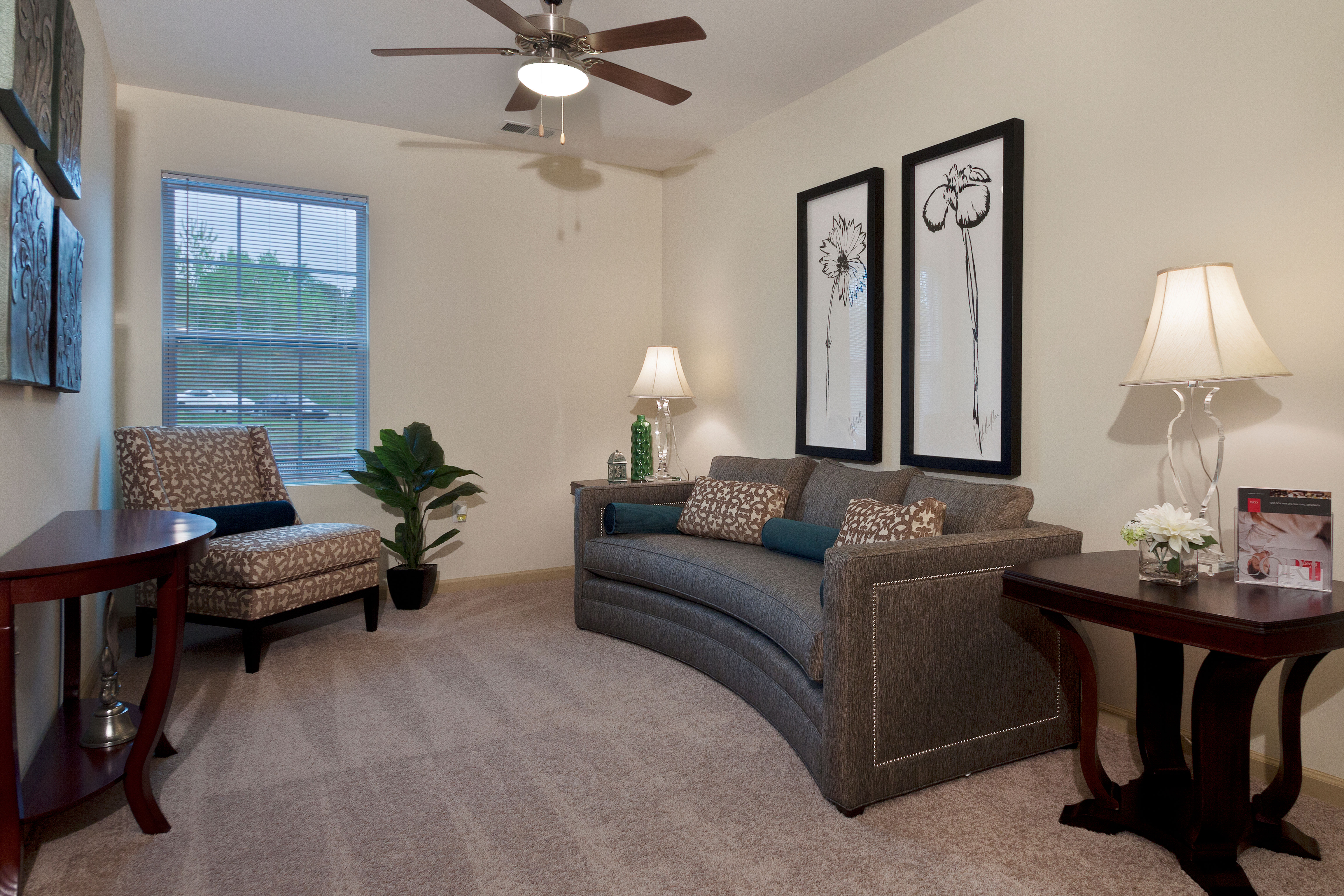 Communal space with couch and ceiling fan at Loftin II in Belmont, North Carolina