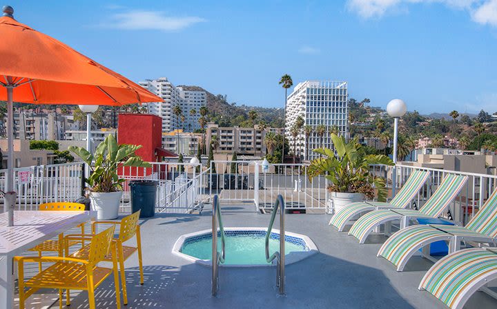 Hot tub and lounge chairs at The Jessica Apartments in Los Angeles, California
